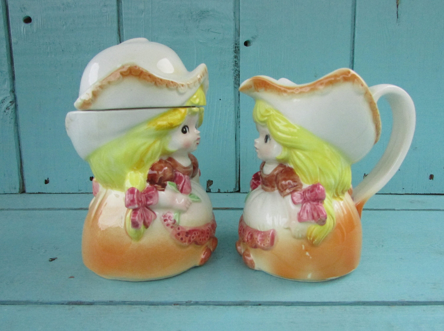Pair of vintage ceramic Dutch girls in traditional costume lidded milk jug & sugar pot