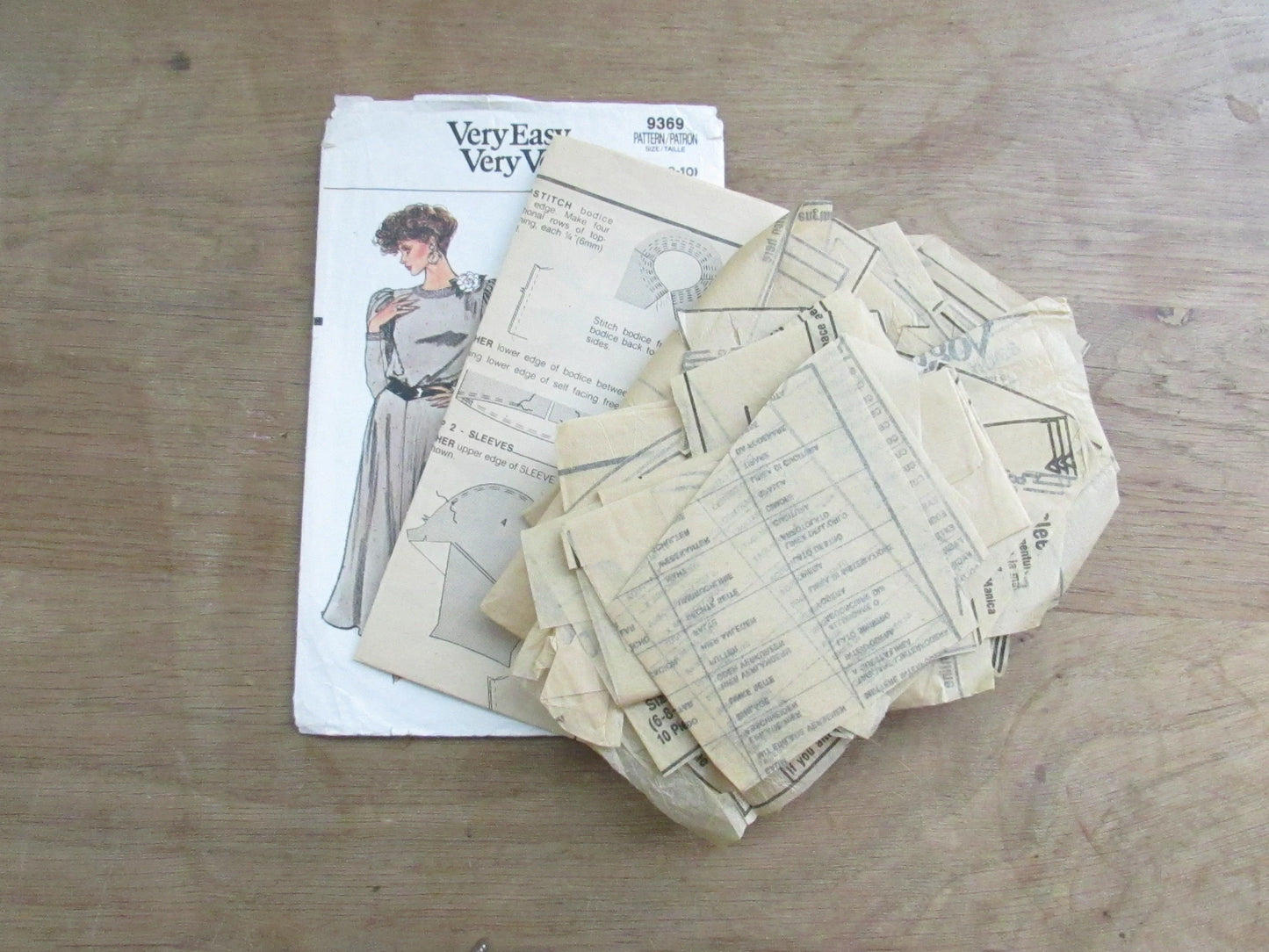 Part cut 1985 Vogue 9369 sewing pattern for misses' dress, cut to size 10 (complete)