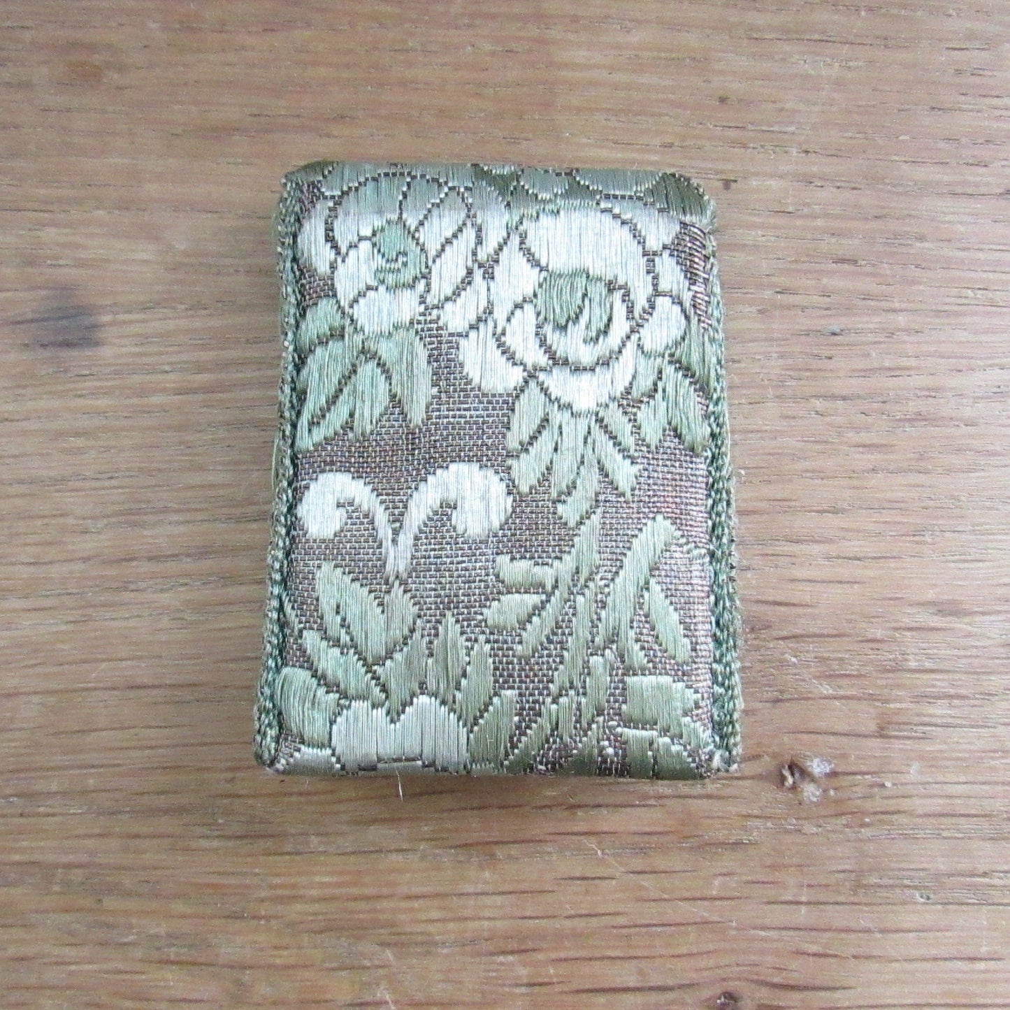 Vintage fabric needle case containing Elephant Brand Hall's nickel plated crewel or embroidery needles No.317