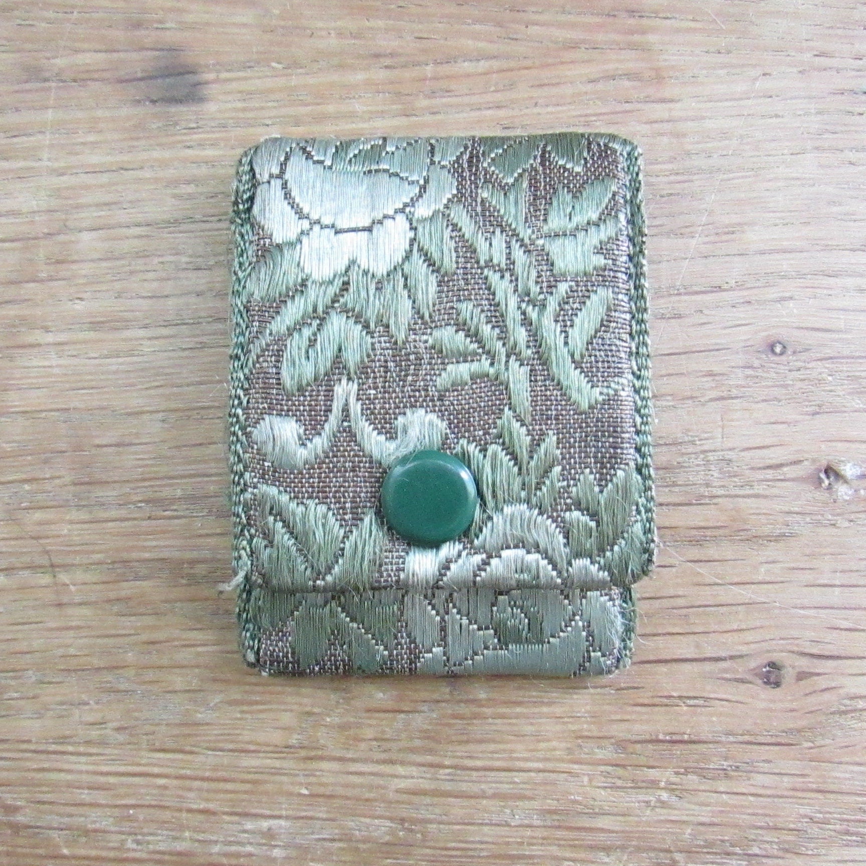 Vintage fabric needle case containing Elephant Brand Hall's nickel plated crewel or embroidery needles No.317