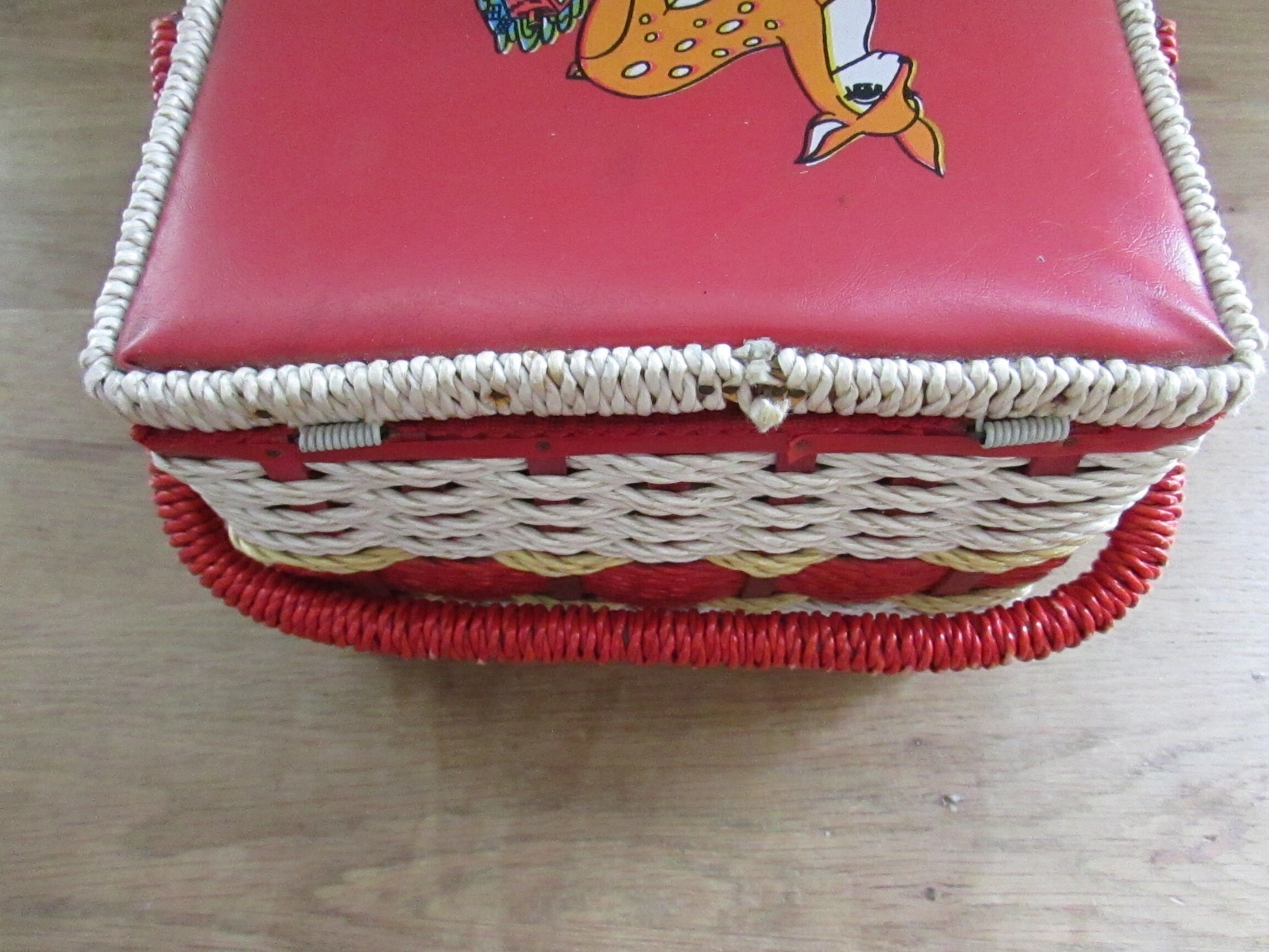 Mid-century red vinyl & wicker sewing box, depicting mother and baby deer