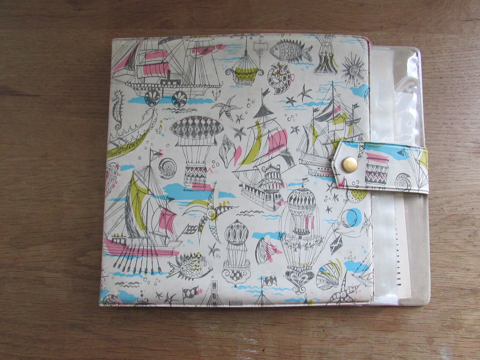1960s hardcover vinyl record case for 7inch singles, illustrated with ships & hot air balloons