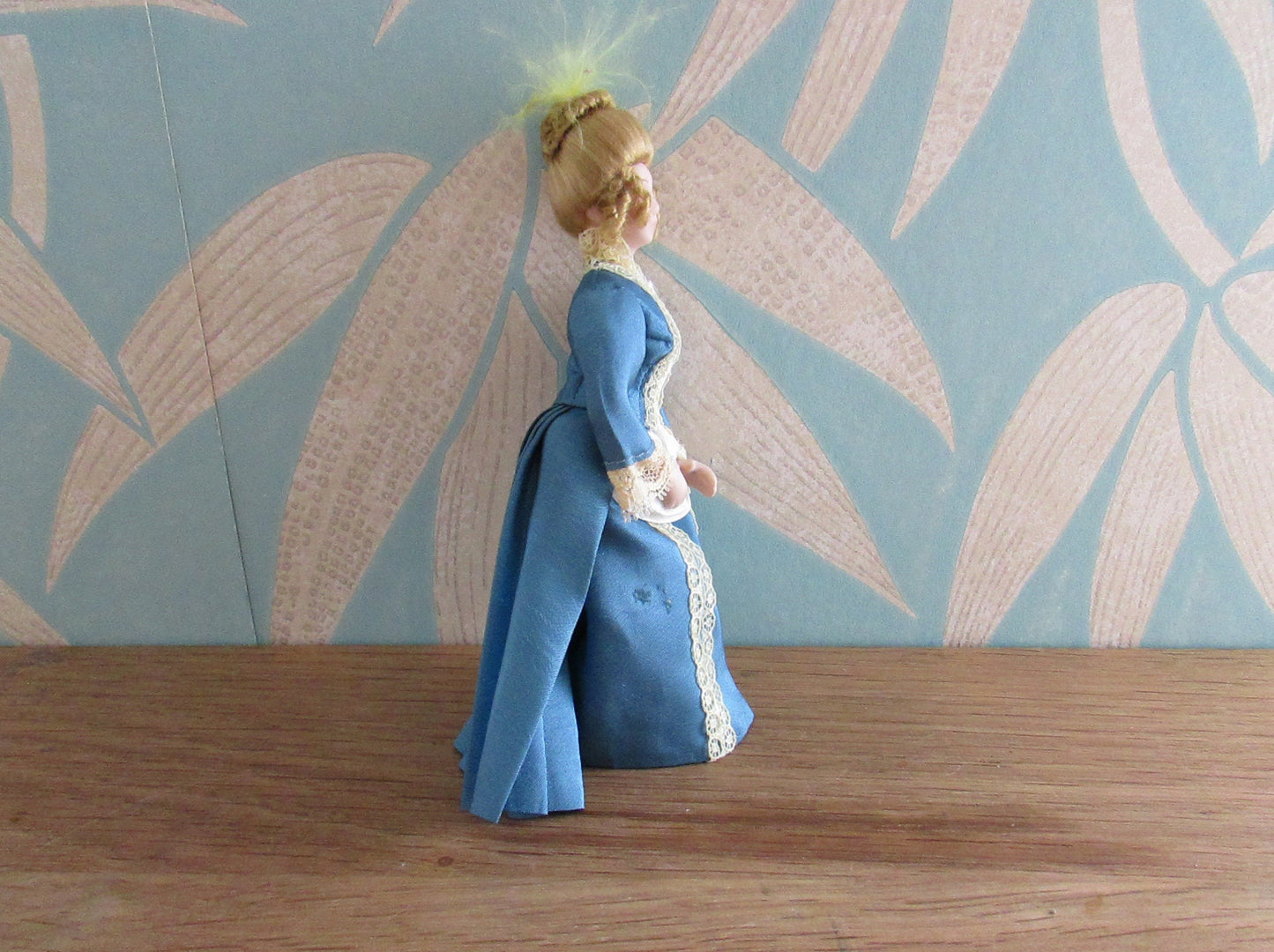 Vintage miniature porcelain doll's house doll in traditional Victorian dress