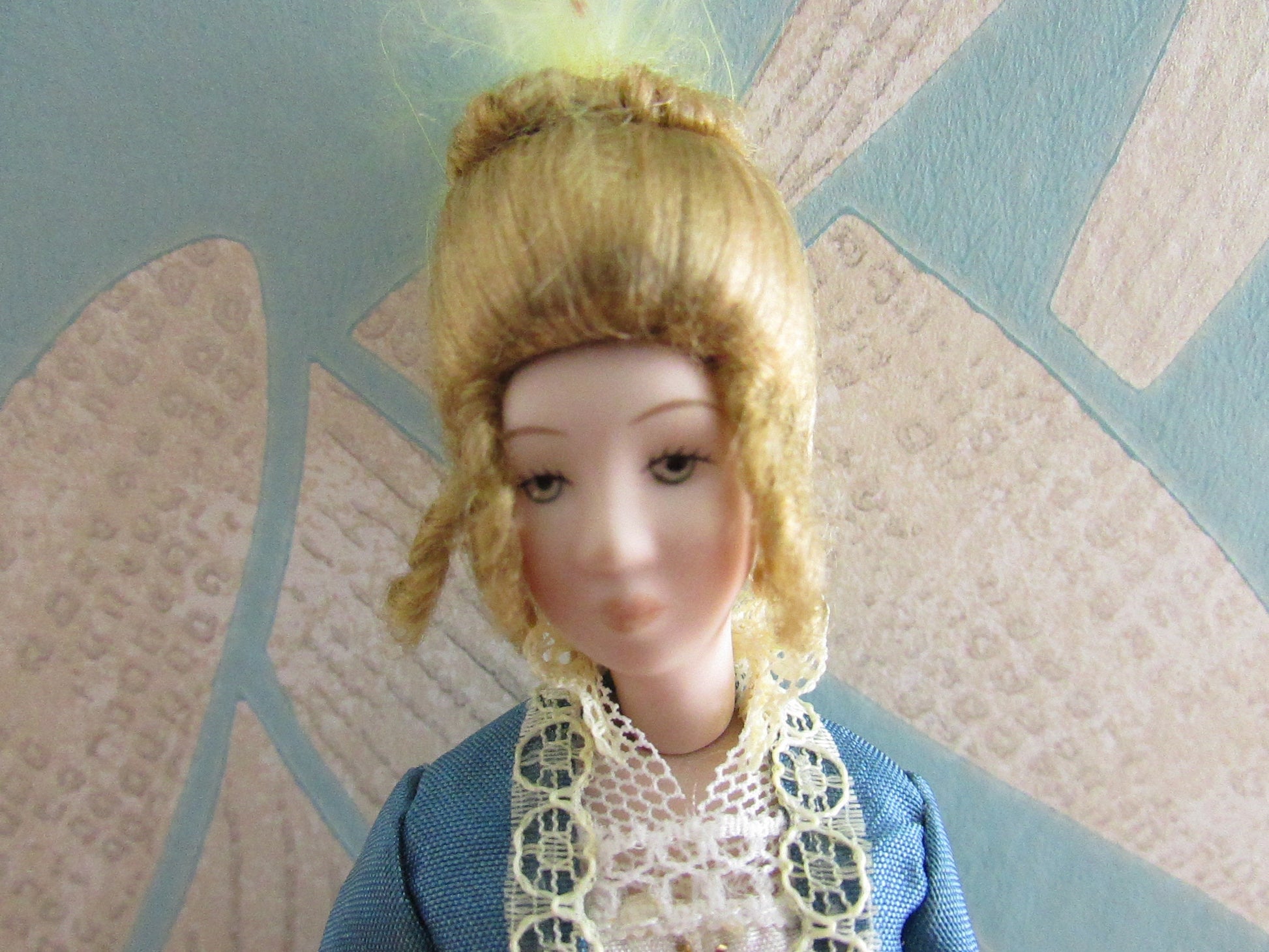 Vintage miniature porcelain doll's house doll in traditional Victorian dress