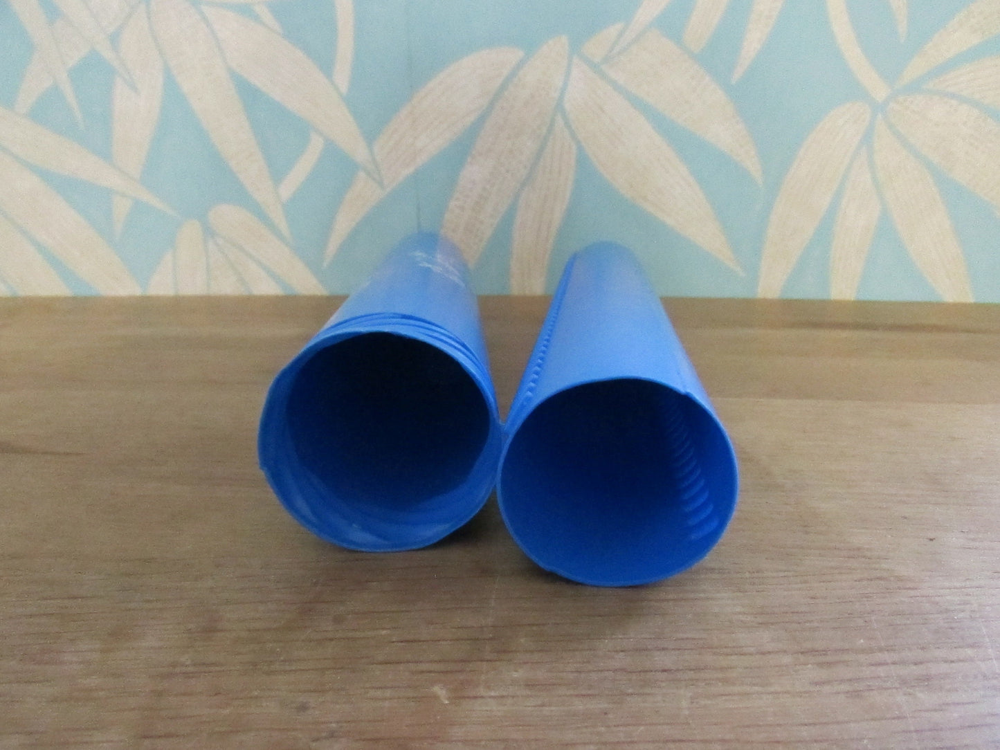 Vintage blue plastic certificate holder tube with cartoon motif