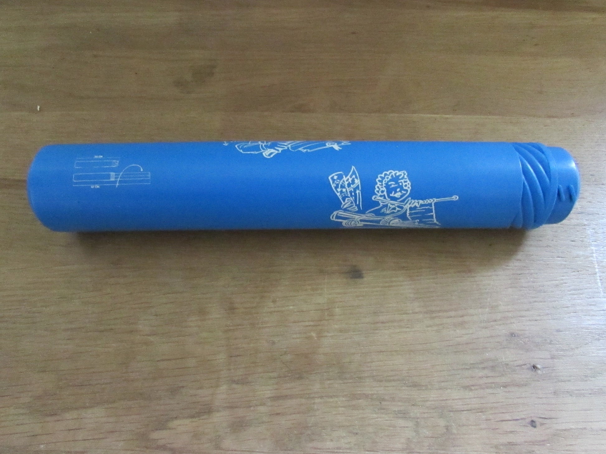 Vintage blue plastic certificate holder tube with cartoon motif