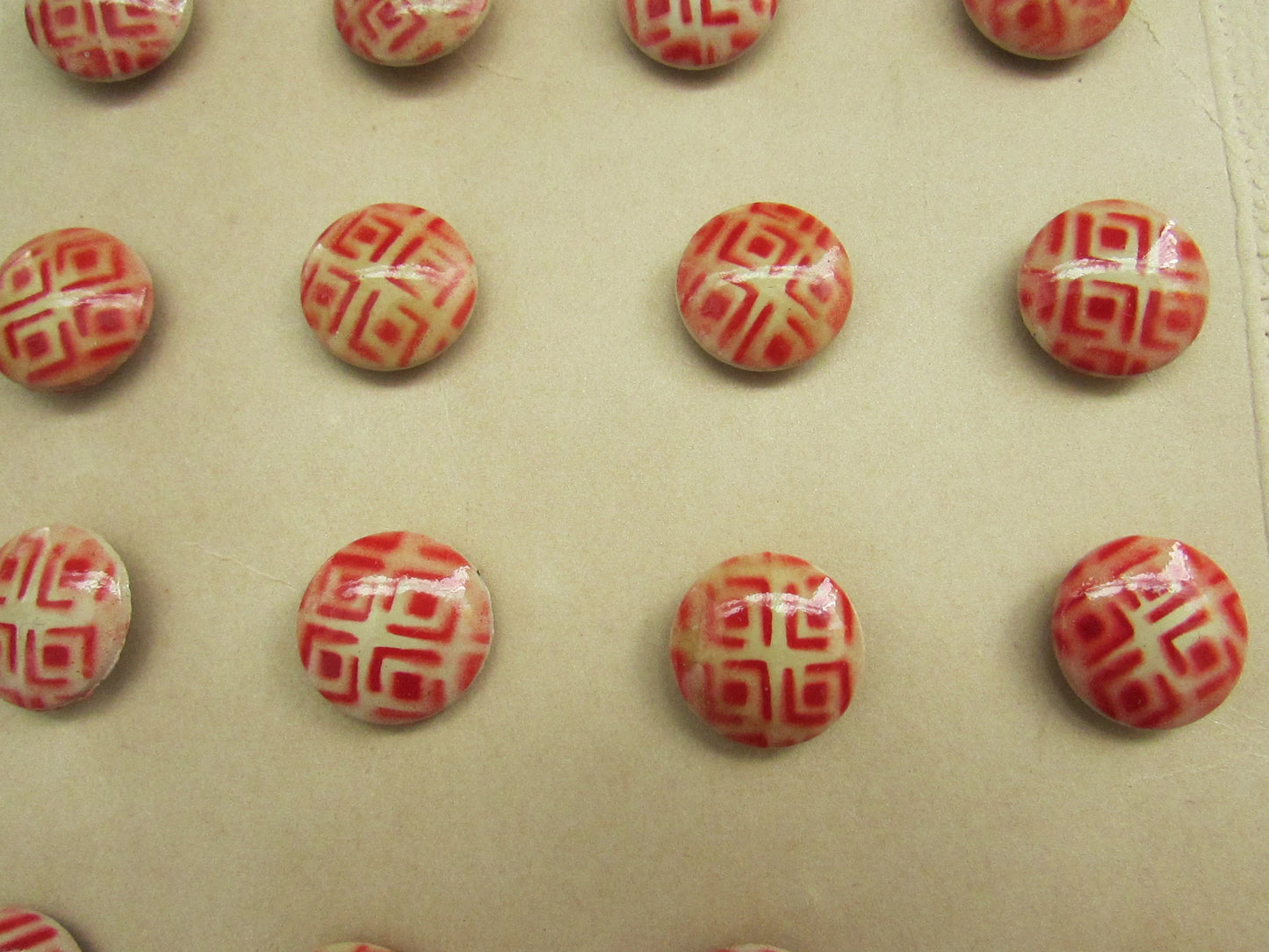 Vintage carded red & white geometric pattern buttons x24