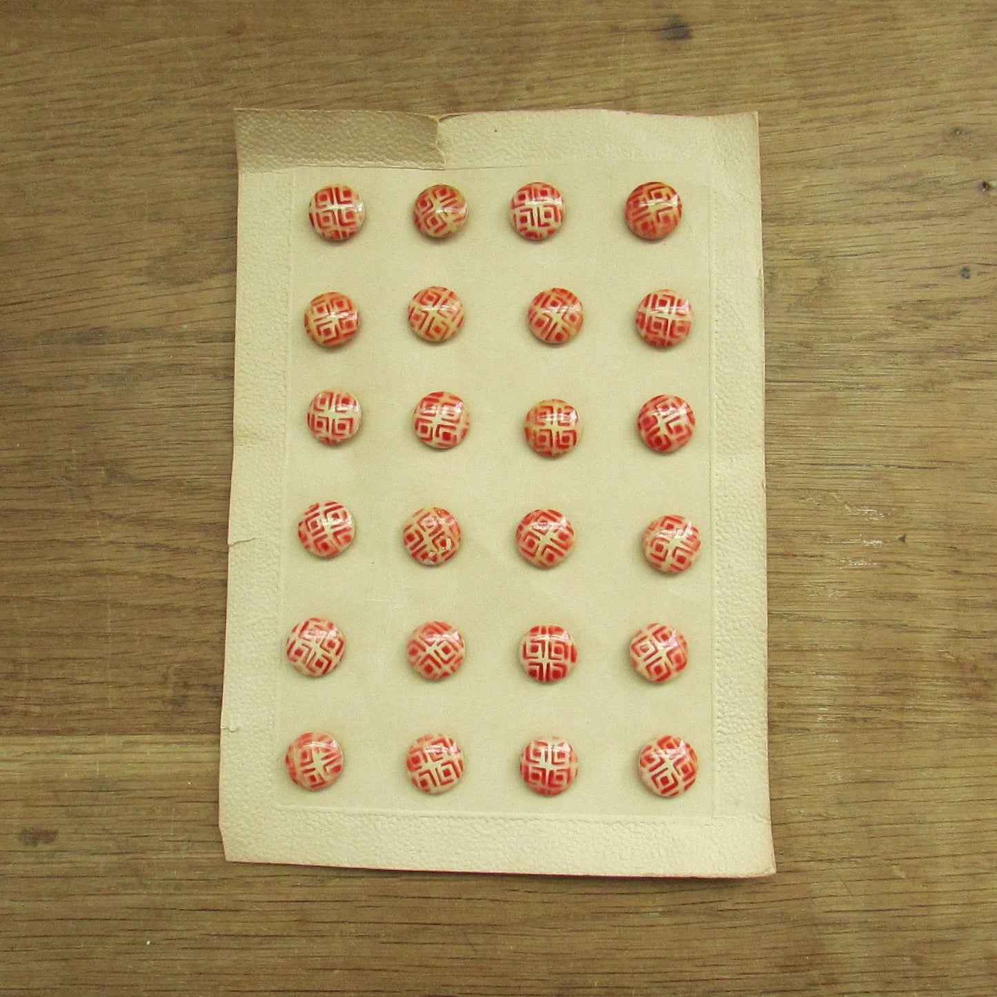 Vintage carded red & white geometric pattern buttons x24