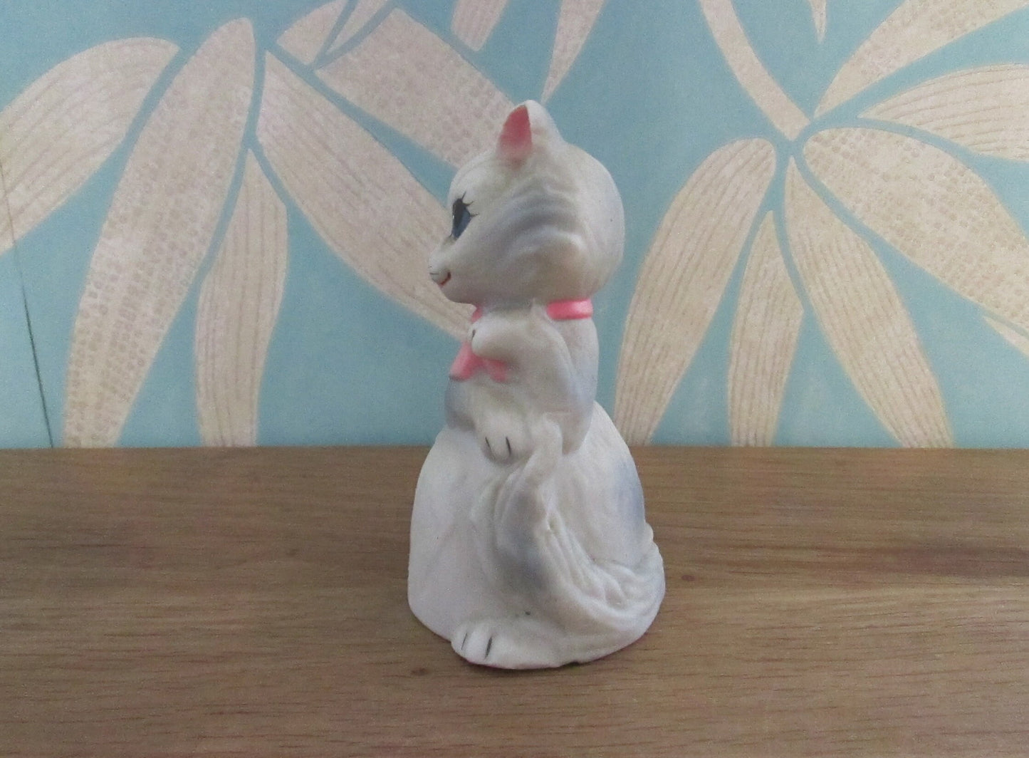 Vintage porcelain cat/kitten-shaped bell, pink bow tie detail