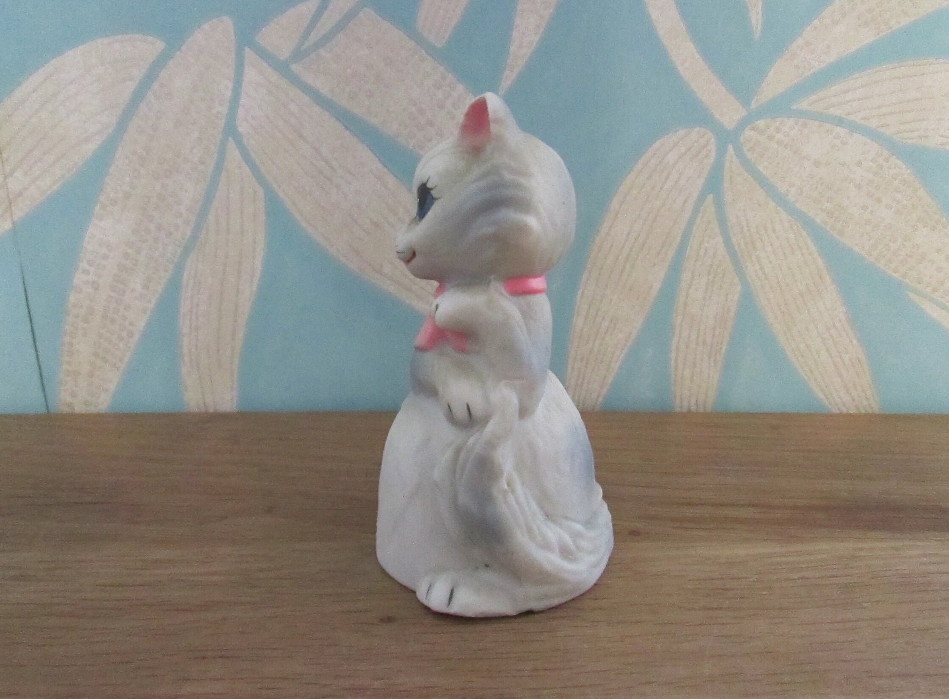 Vintage porcelain cat/kitten-shaped bell, pink bow tie detail