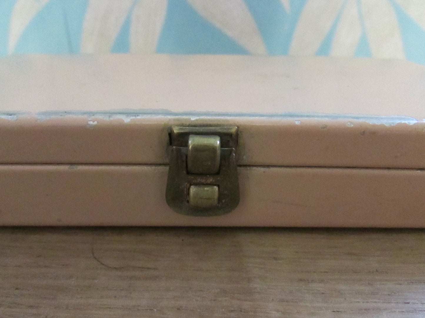 Mid-century travel vanity set in peach-coloured metal case