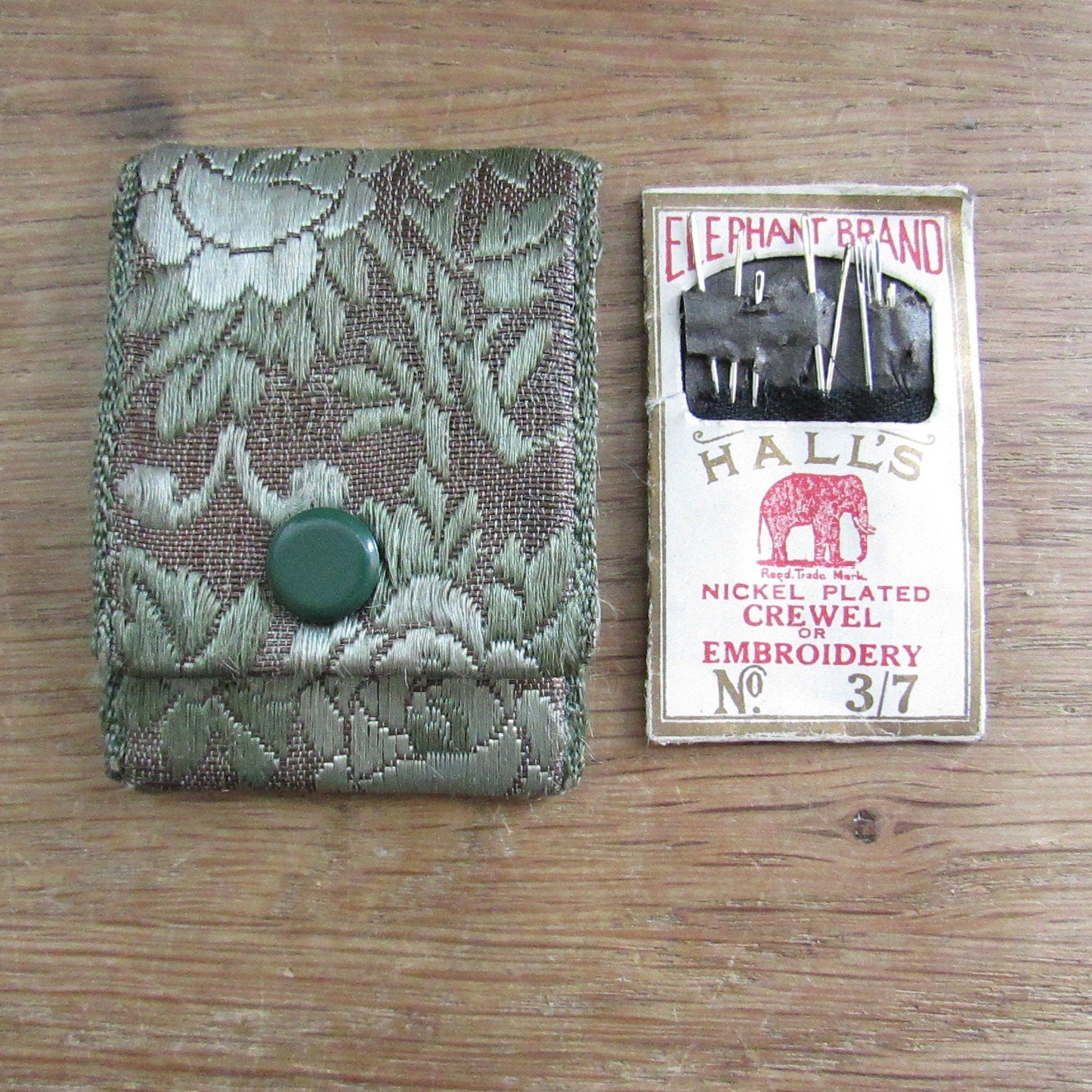 Vintage fabric needle case containing Elephant Brand Hall's nickel plated crewel or embroidery needles No.317