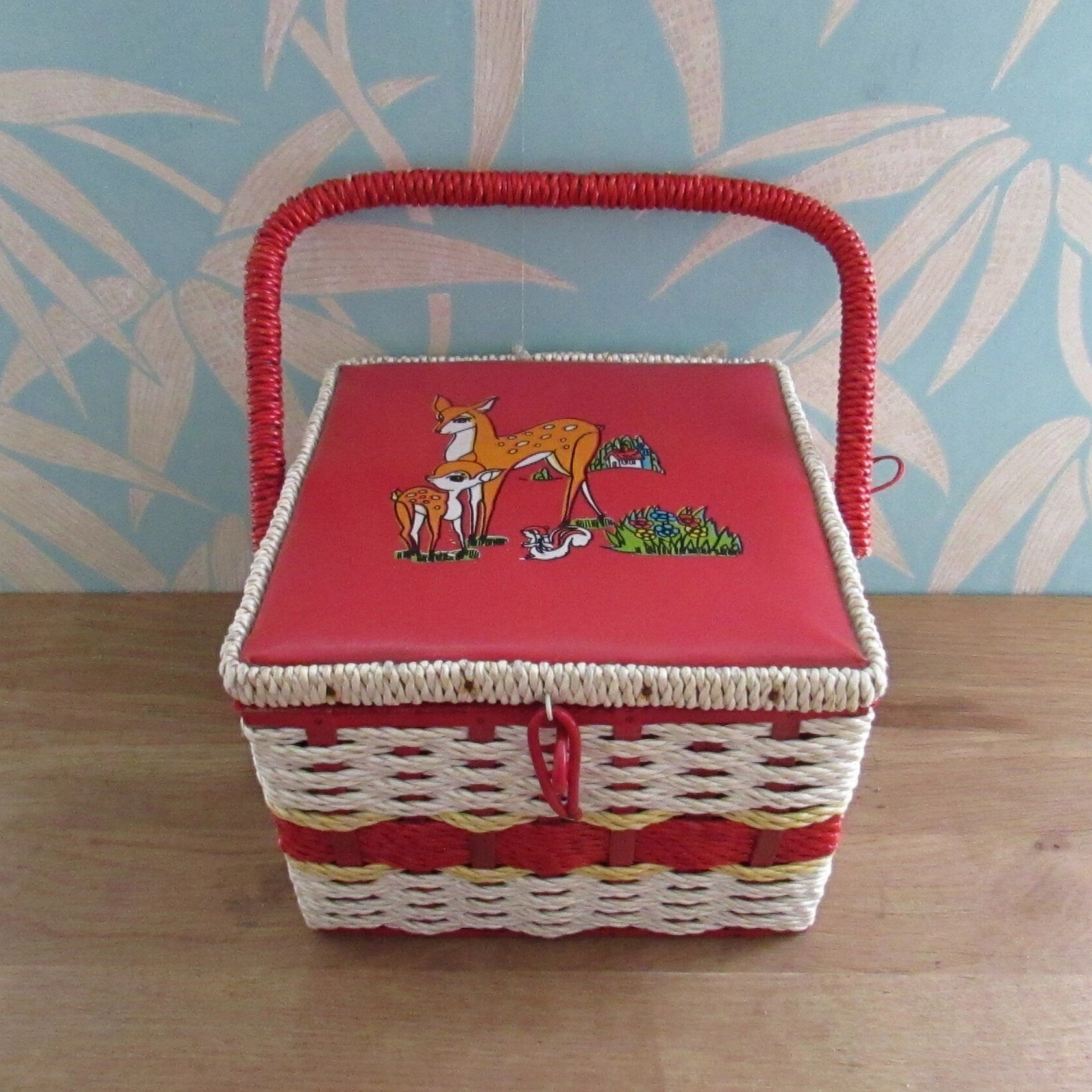 Mid-century red vinyl & wicker sewing box, depicting mother and baby deer