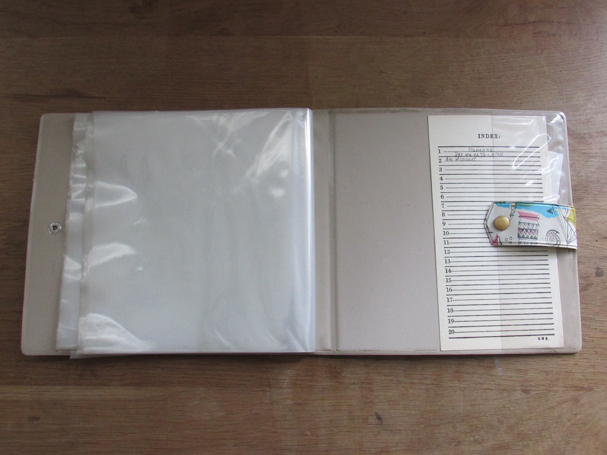 1960s hardcover vinyl record case for 7inch singles, illustrated with ships & hot air balloons