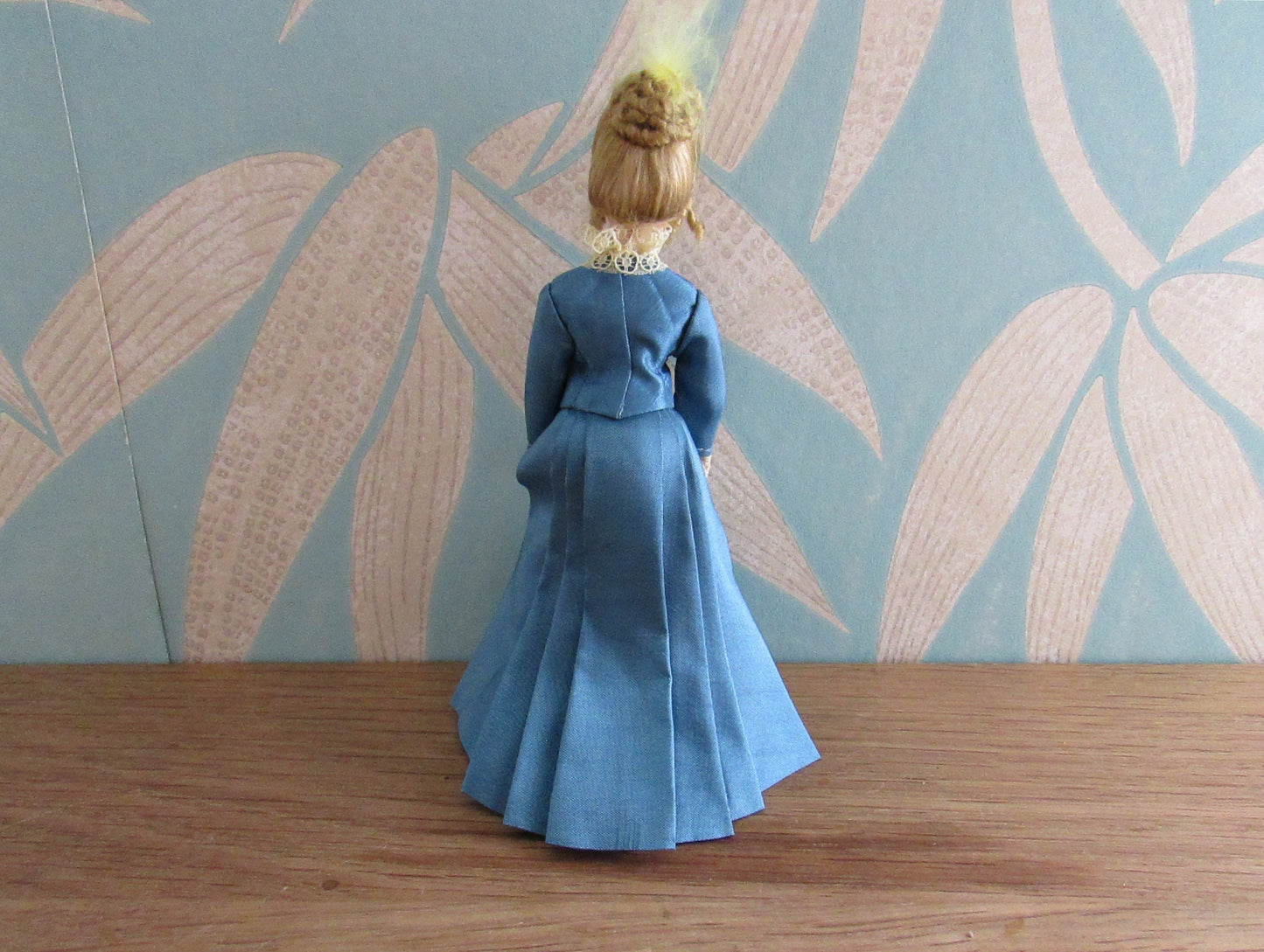 Vintage miniature porcelain doll's house doll in traditional Victorian dress