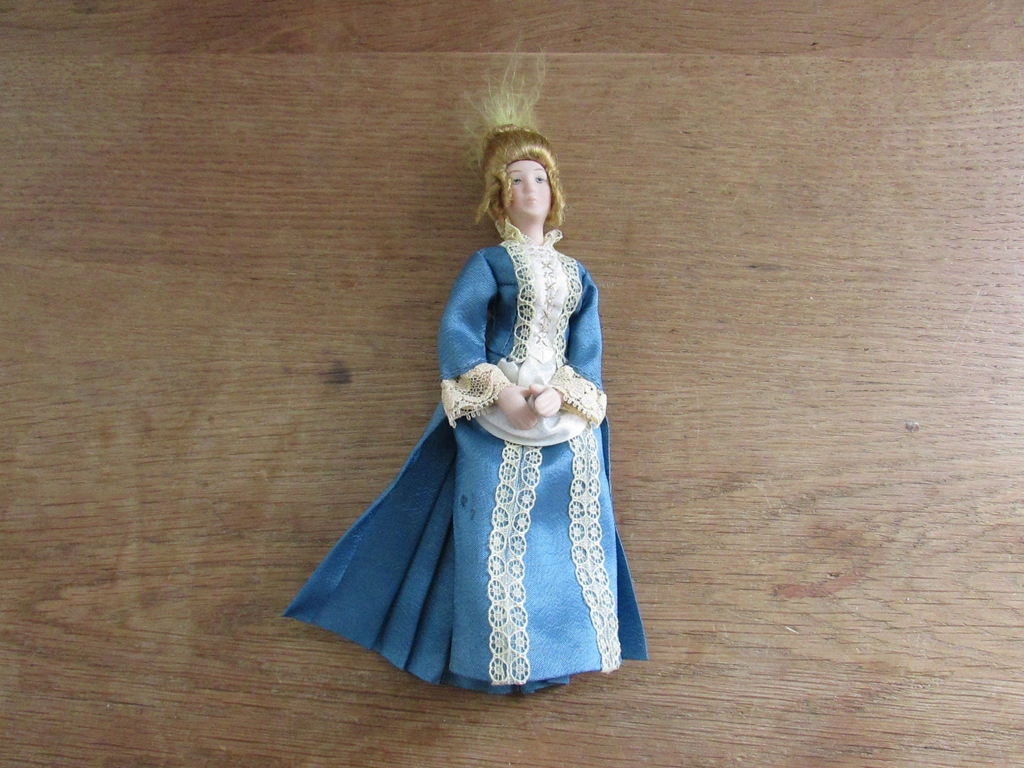 Vintage miniature porcelain doll's house doll in traditional Victorian dress