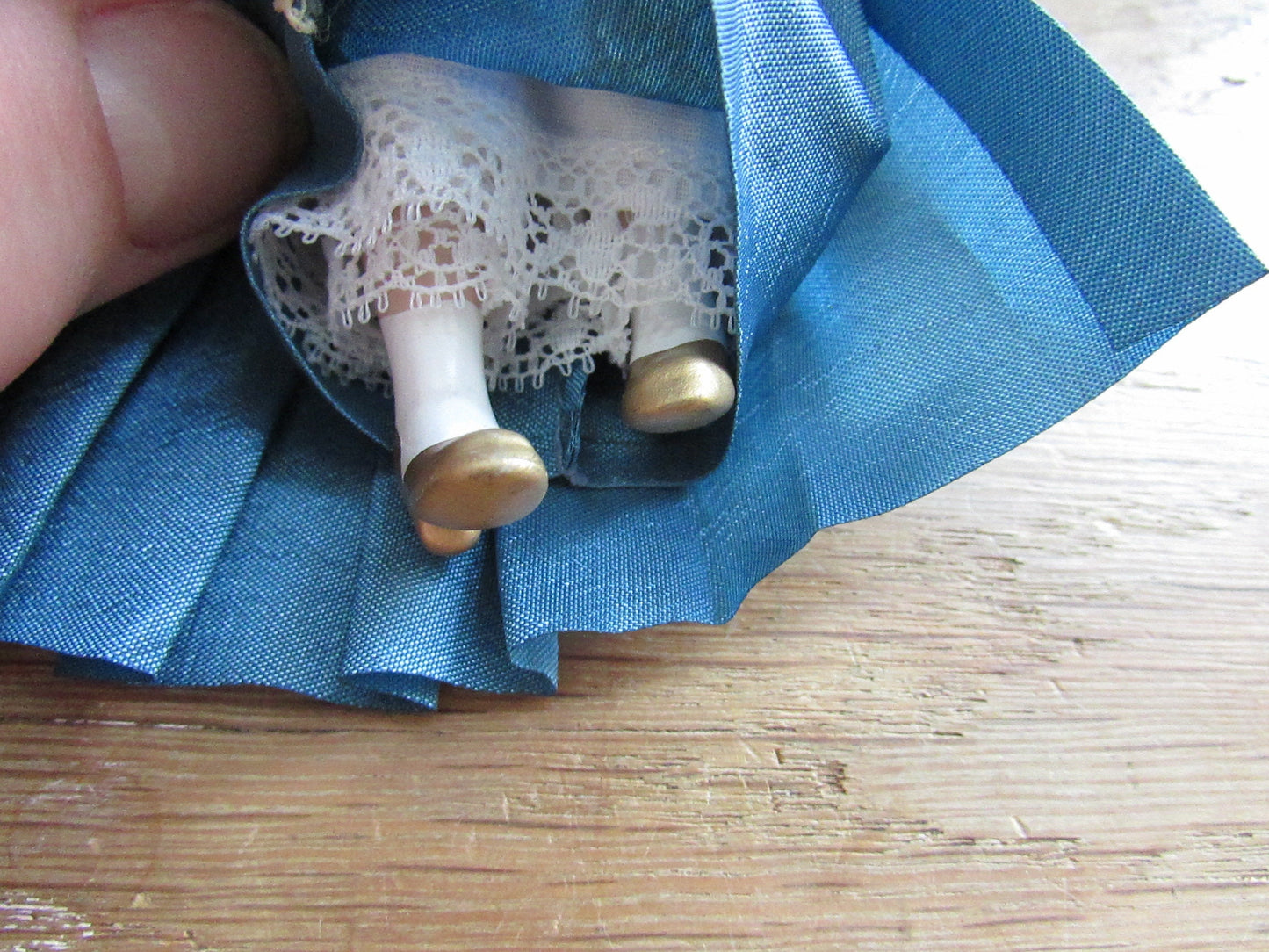 Vintage miniature porcelain doll's house doll in traditional Victorian dress