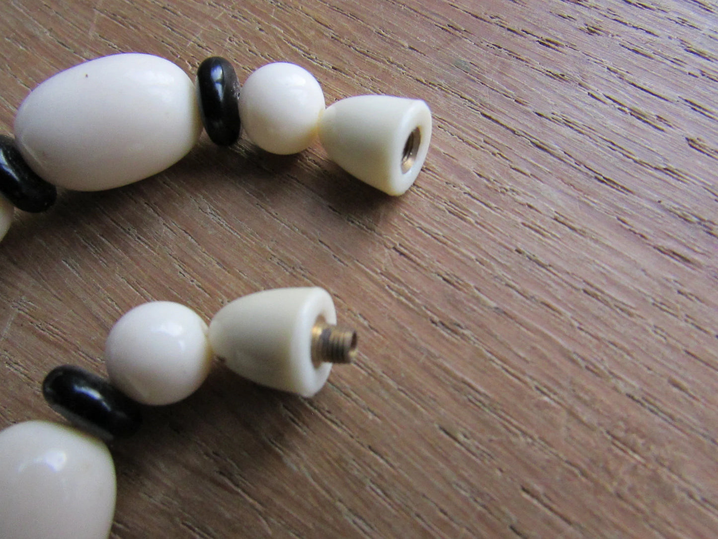 1960s white plastic geometric triangular bead necklace with black spacer beads