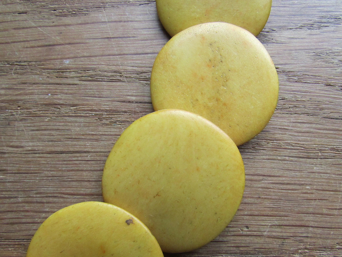 1970s yellow/mustard graduating flat disc Tagua nut necklace