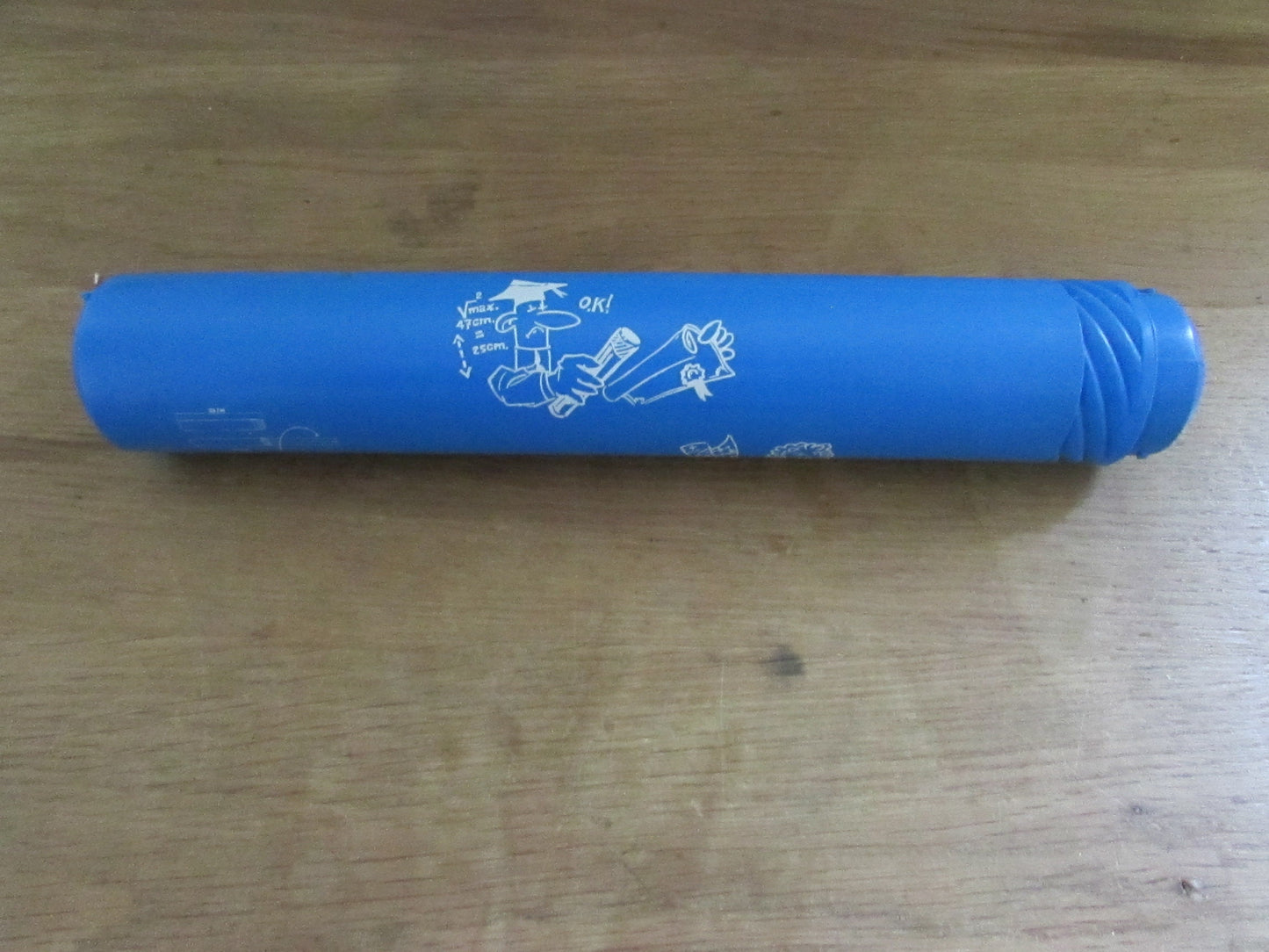 Vintage blue plastic certificate holder tube with cartoon motif