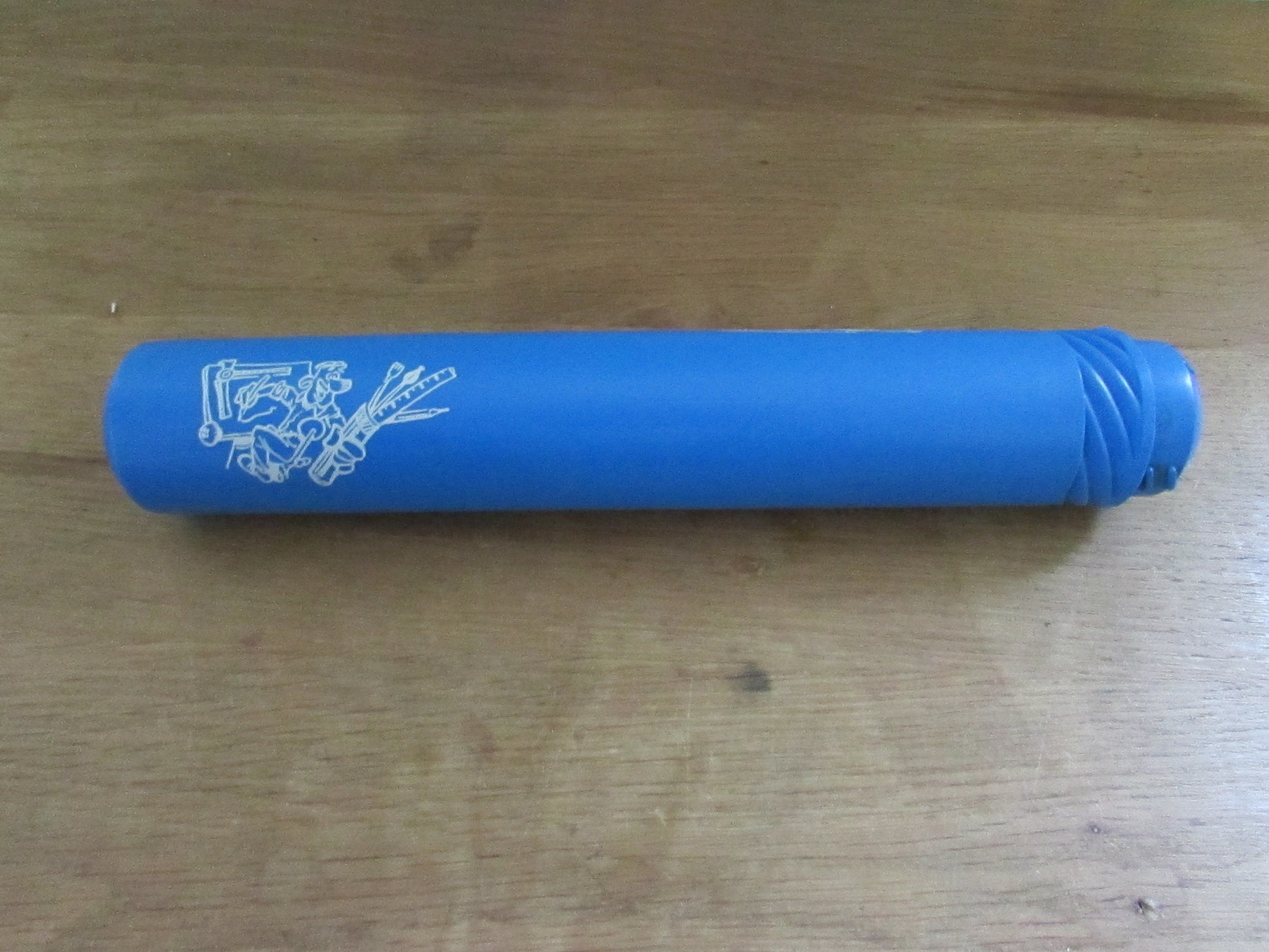 Vintage blue plastic certificate holder tube with cartoon motif