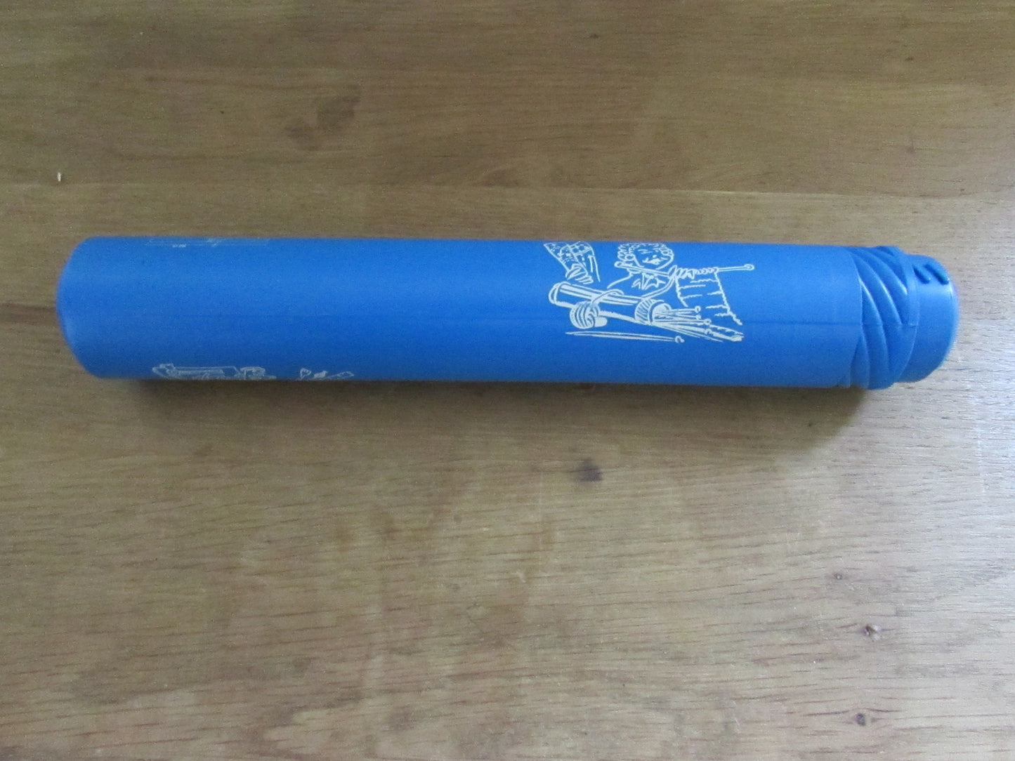 Vintage blue plastic certificate holder tube with cartoon motif