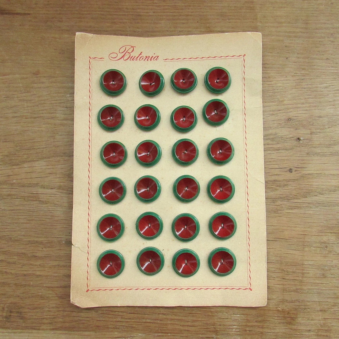 1960s Butonia carded two-tone green/maroon buttons x24