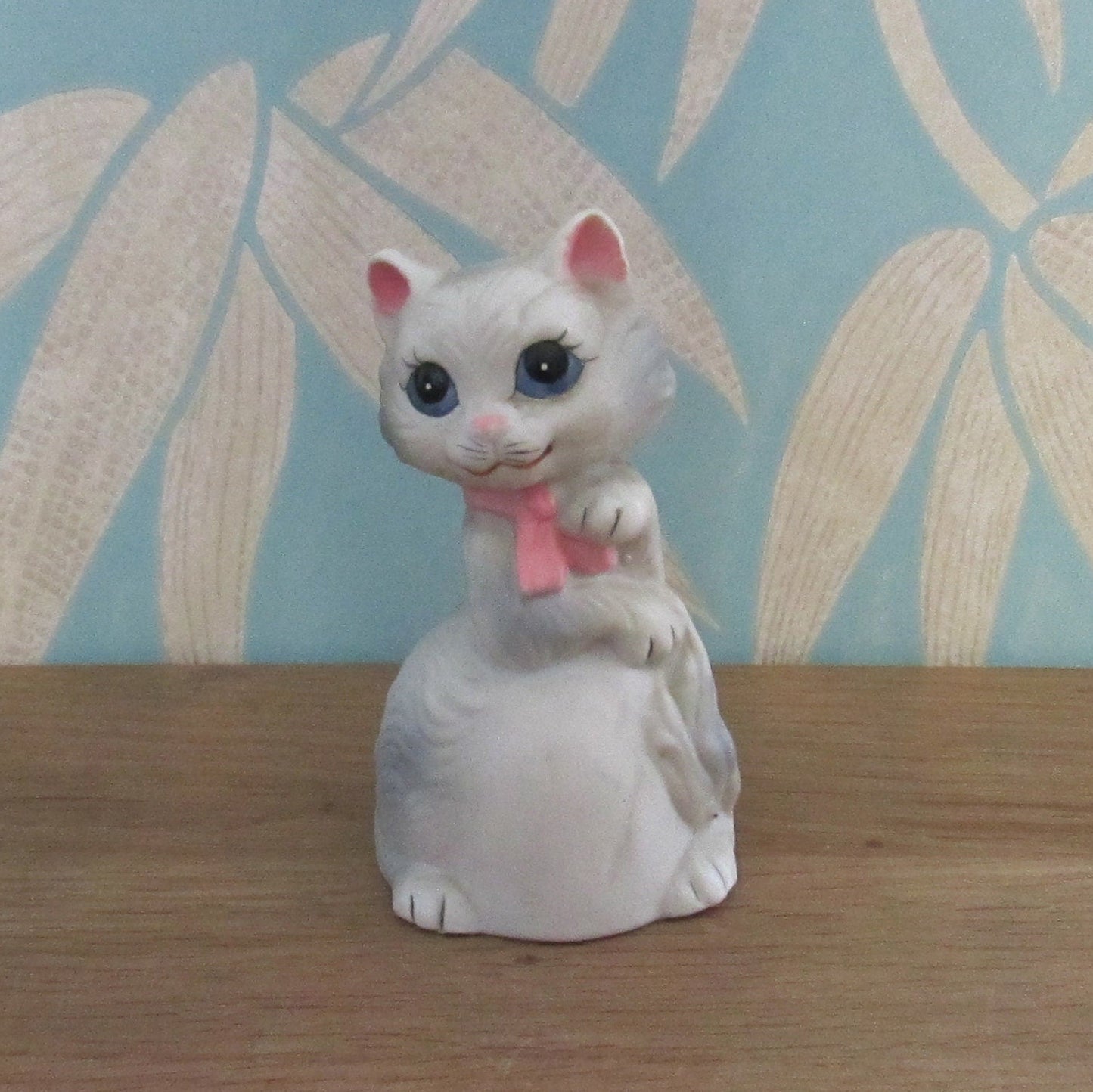 Vintage porcelain cat/kitten-shaped bell, pink bow tie detail