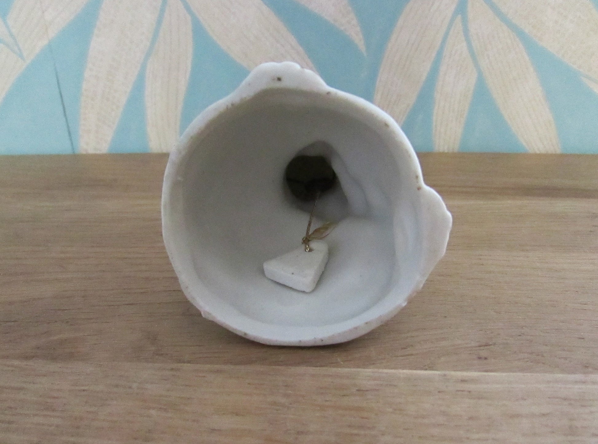 Vintage porcelain cat/kitten-shaped bell, pink bow tie detail