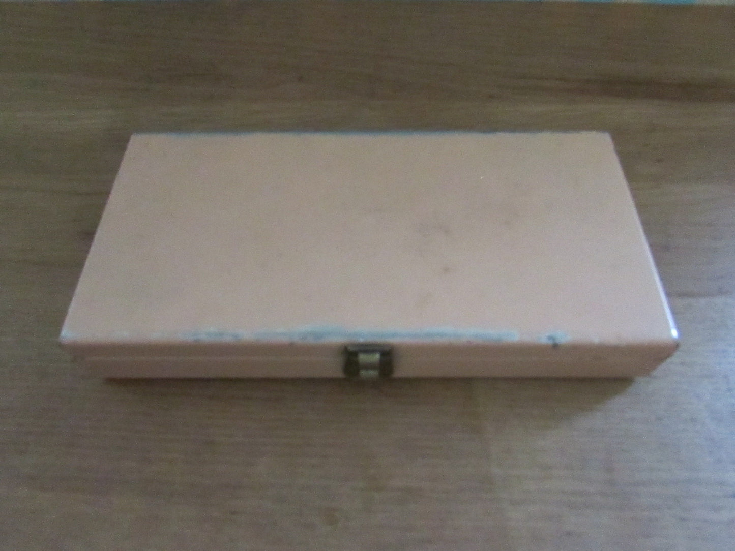 Mid-century travel vanity set in peach-coloured metal case