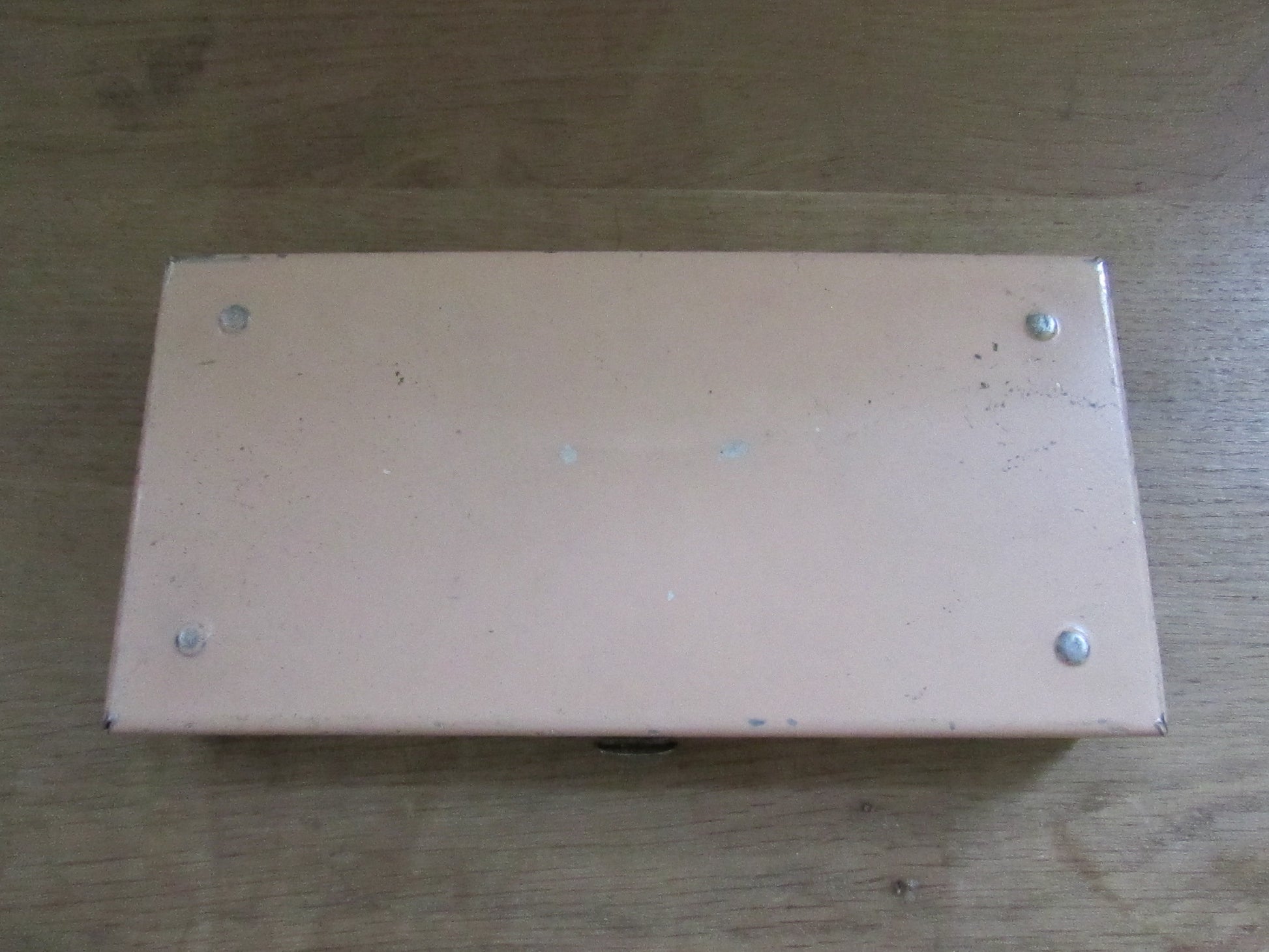 Mid-century travel vanity set in peach-coloured metal case