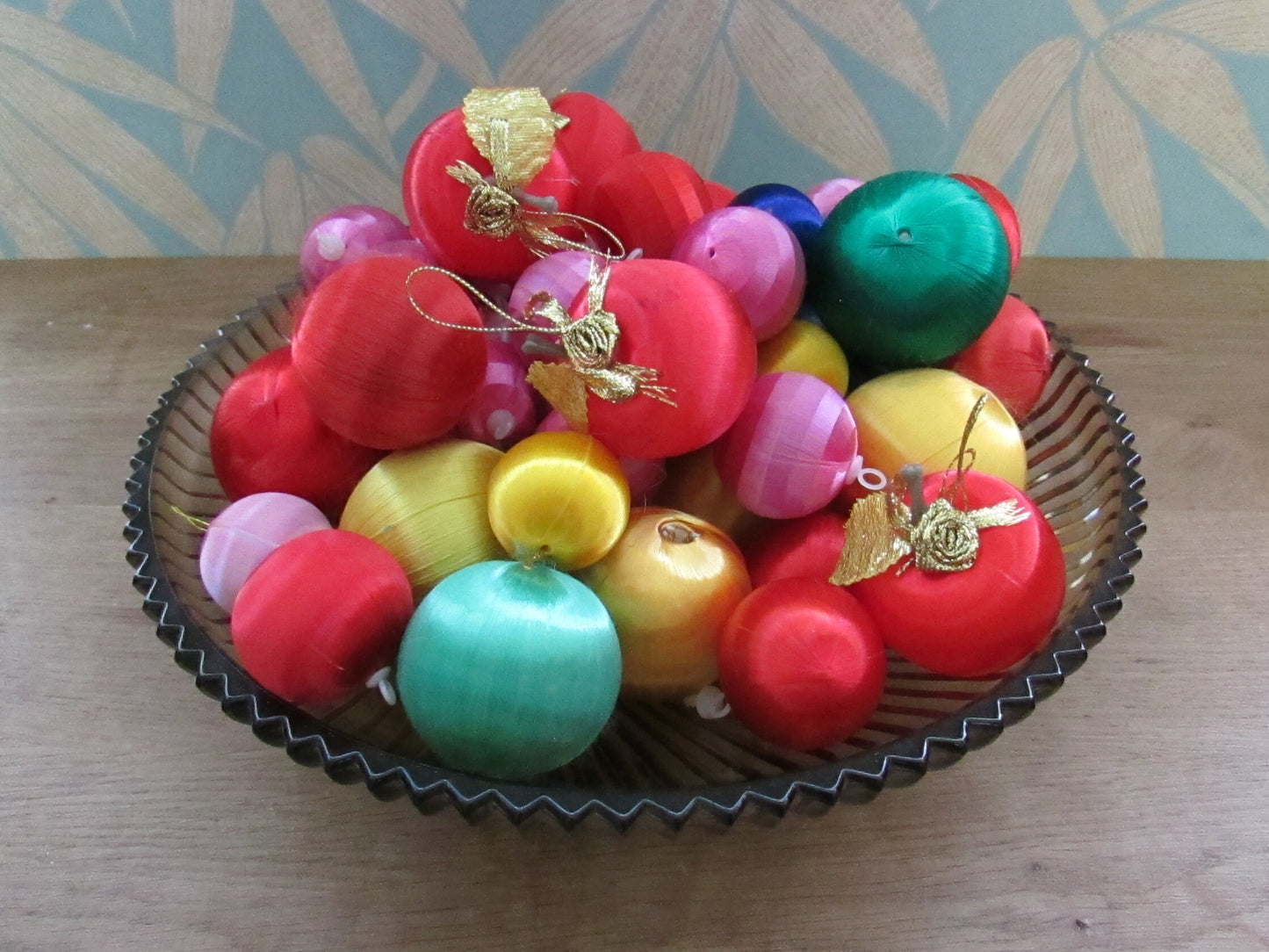 Mid-century jewel-coloured spun satin/silk bauble bundle, including apples with gold leaves