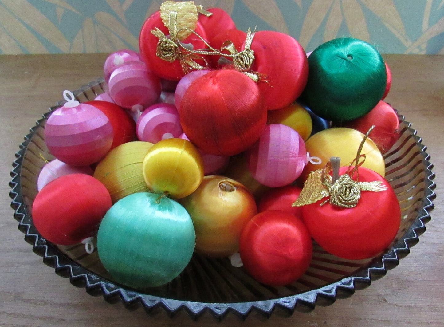 Mid-century jewel-coloured spun satin/silk bauble bundle, including apples with gold leaves