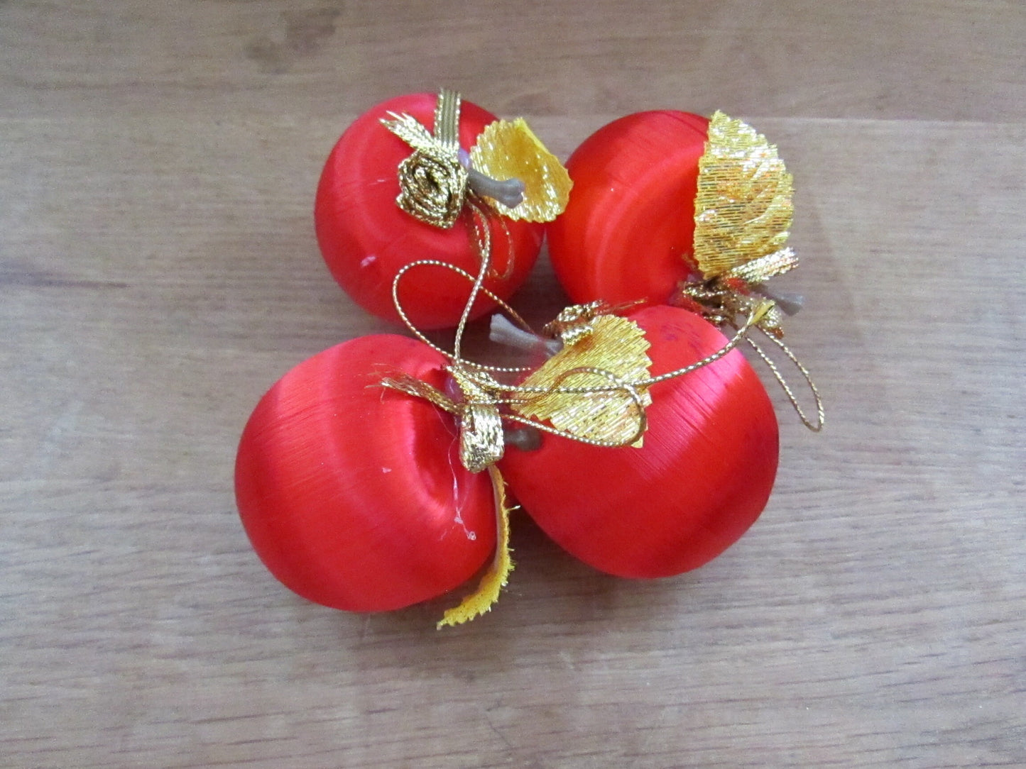 Mid-century jewel-coloured spun satin/silk bauble bundle, including apples with gold leaves