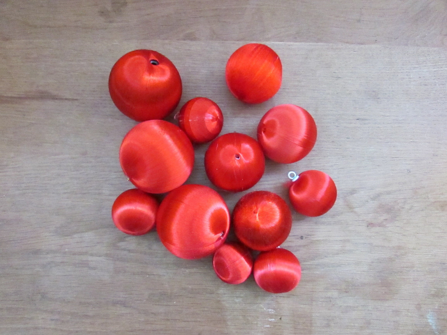 Mid-century jewel-coloured spun satin/silk bauble bundle, including apples with gold leaves