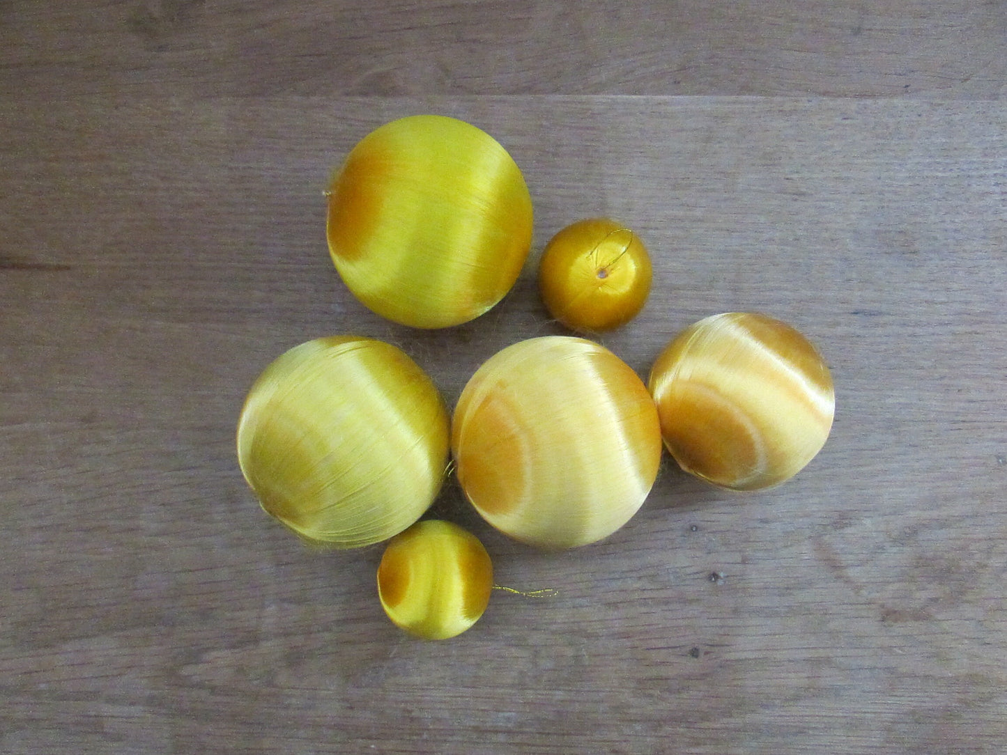 Mid-century jewel-coloured spun satin/silk bauble bundle, including apples with gold leaves
