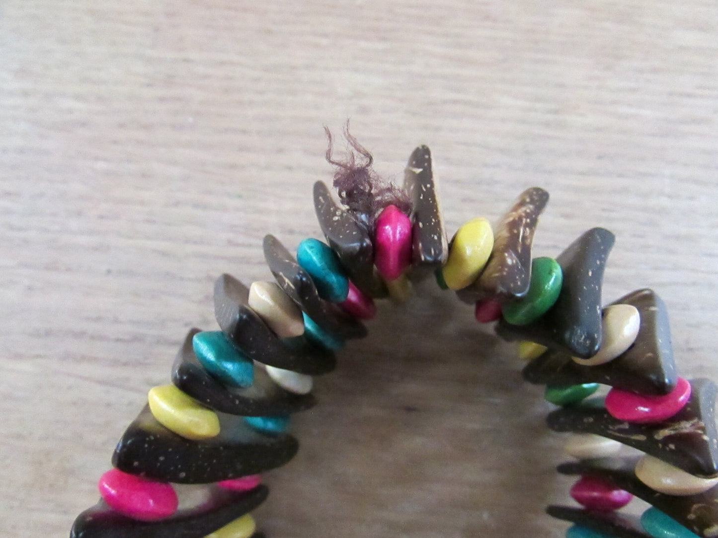 Vintage hand-made coconut shell elasticated bracelet with multi-coloured bead spacers