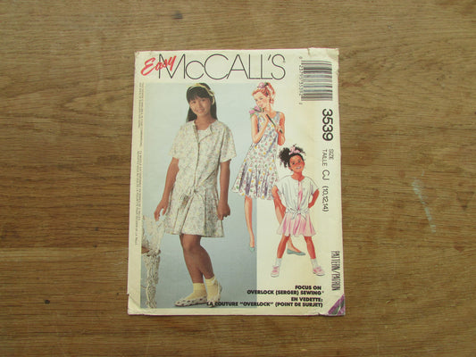 Uncut 1988 McCall's 3539 sewing pattern for girls' skirt & dress, sizes 10-12-14 (complete)