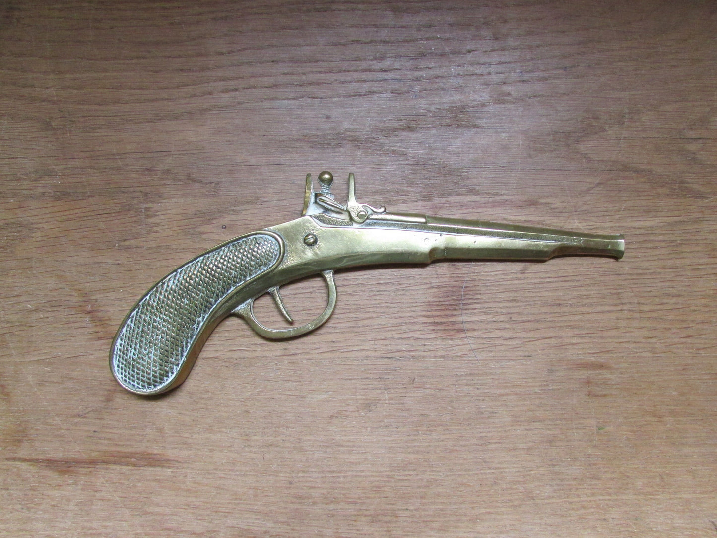 Pair of vintage wall hanging flat brass flintlock pistols