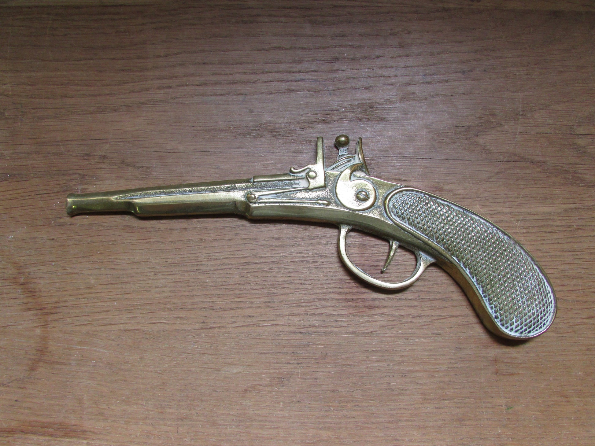 Pair of vintage wall hanging flat brass flintlock pistols