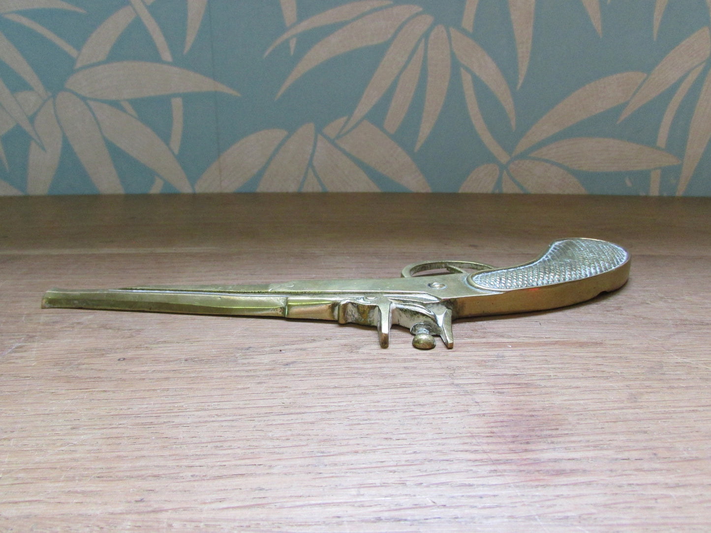 Pair of vintage wall hanging flat brass flintlock pistols