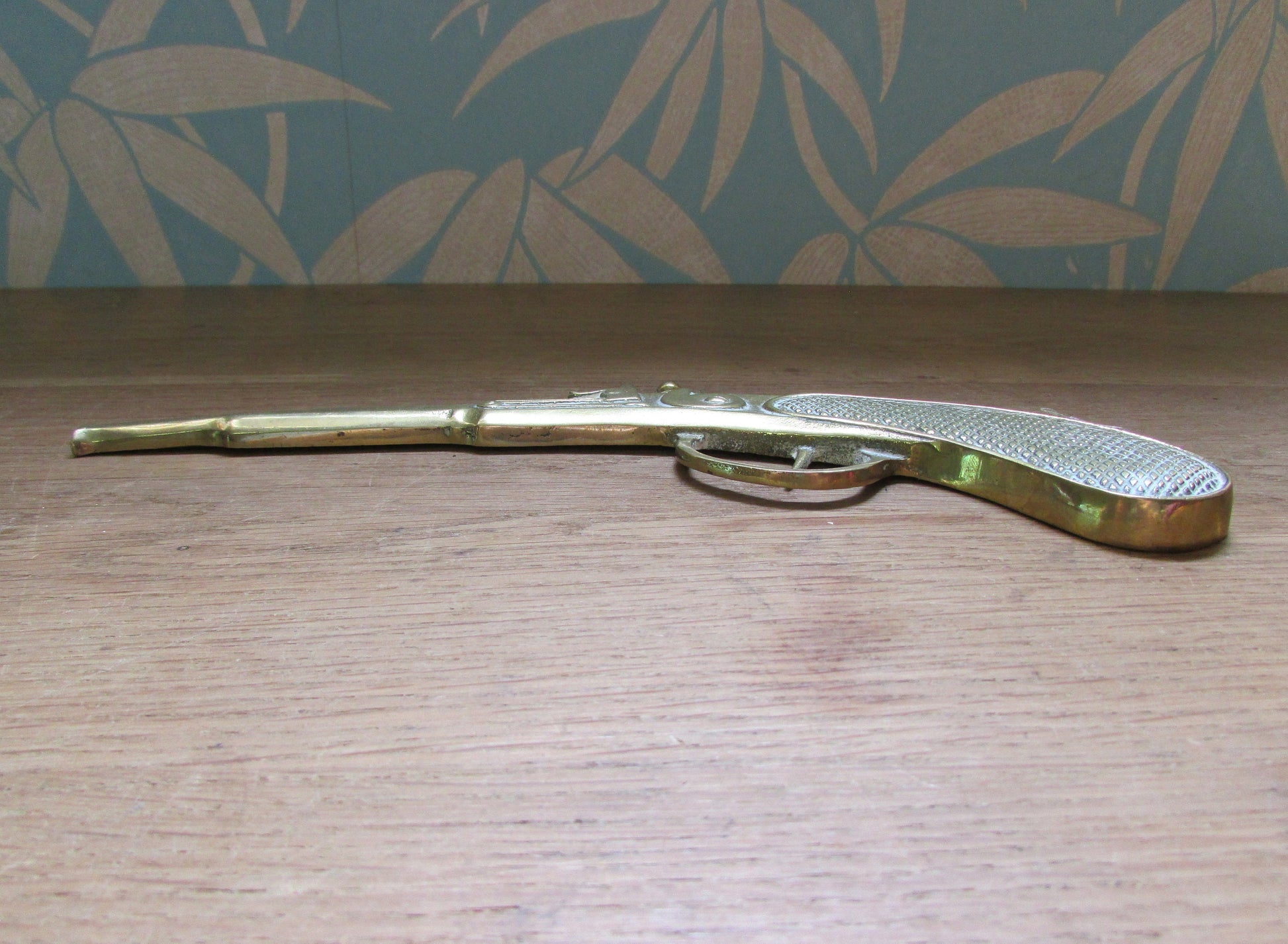 Pair of vintage wall hanging flat brass flintlock pistols