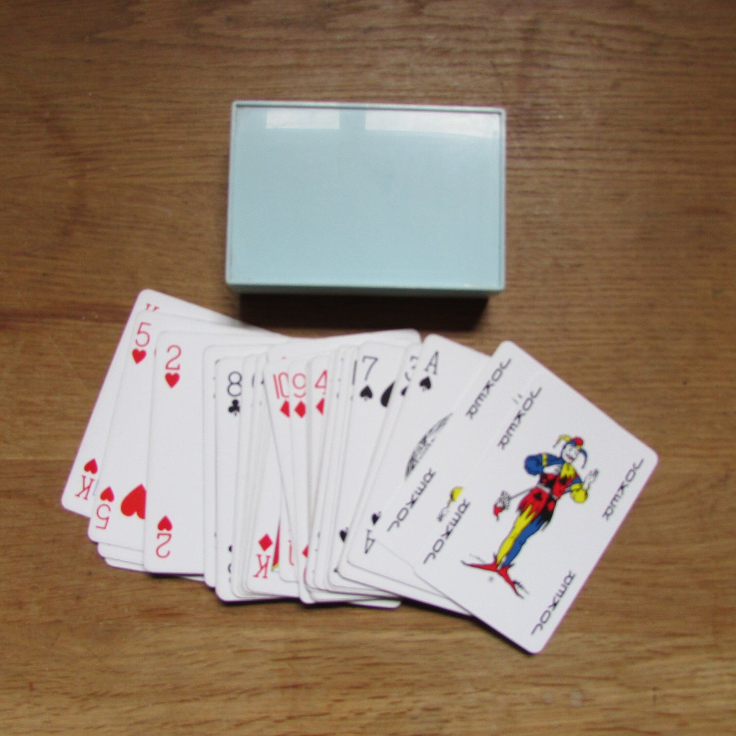 Vintage playing cards in plastic box