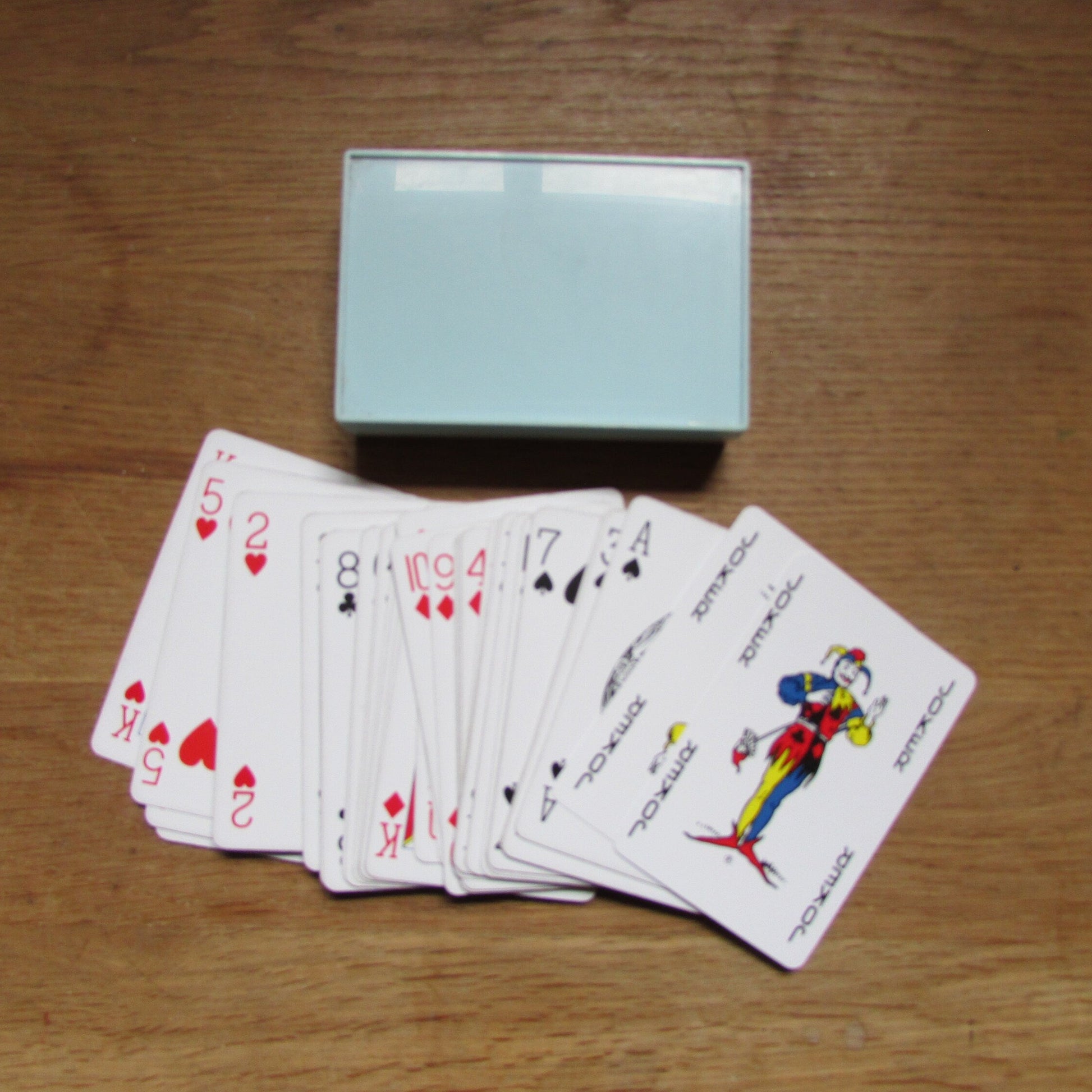 Vintage playing cards in plastic box