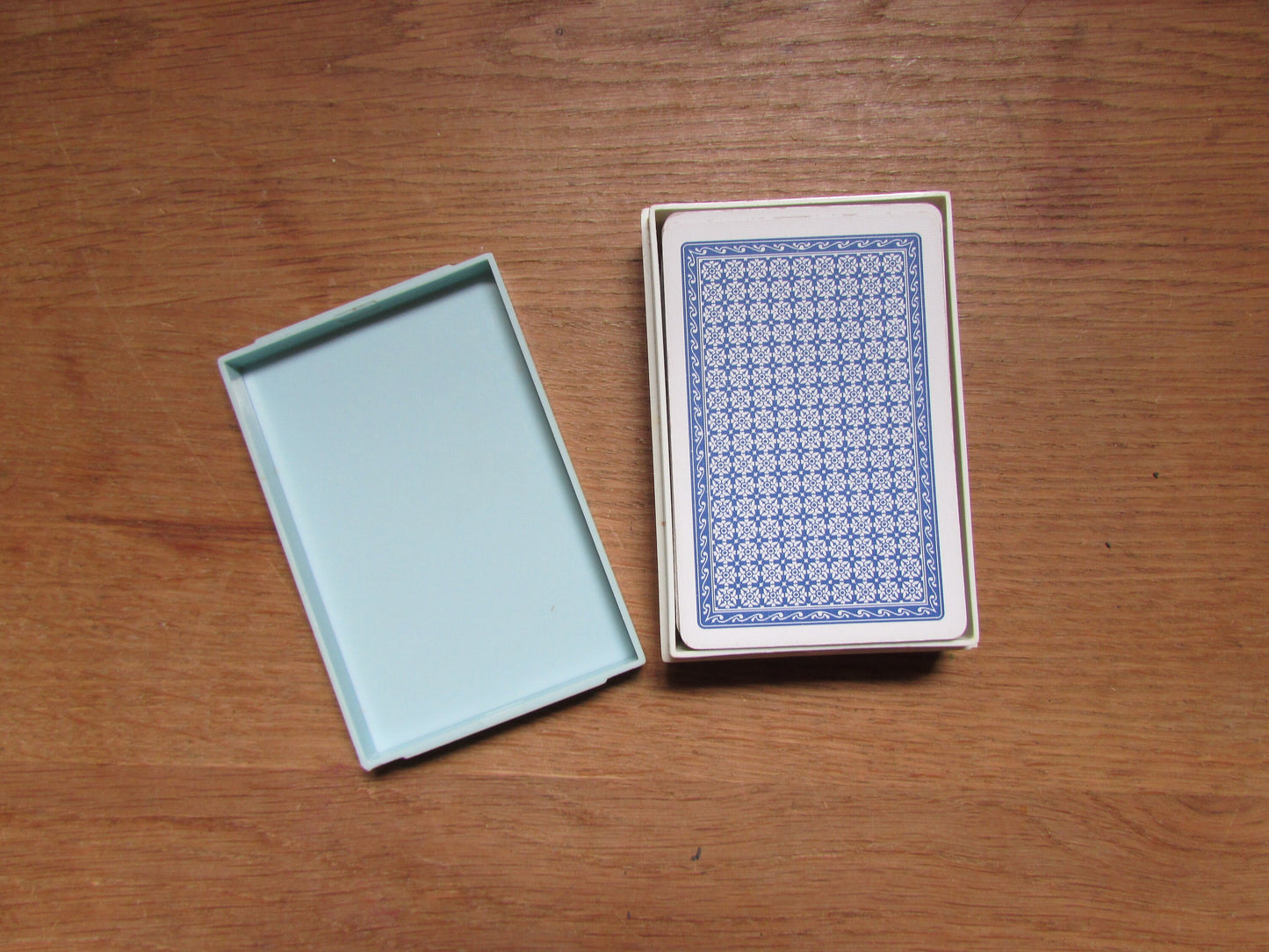Vintage playing cards in plastic box