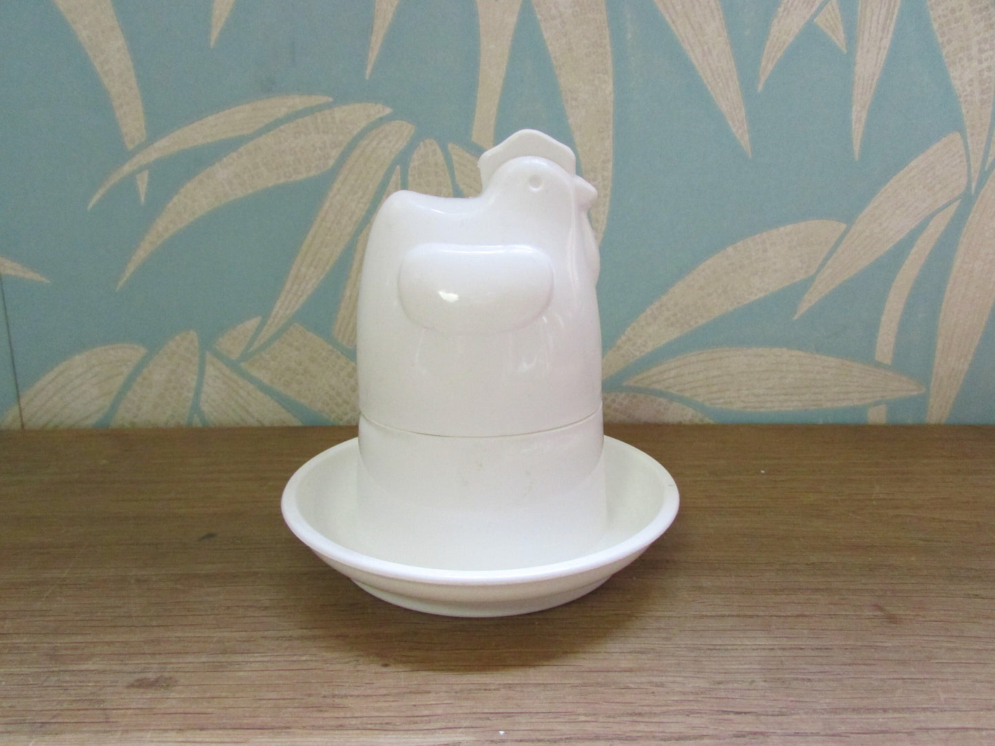 Retro white plastic microwaveable chicken-shaped egg poacher