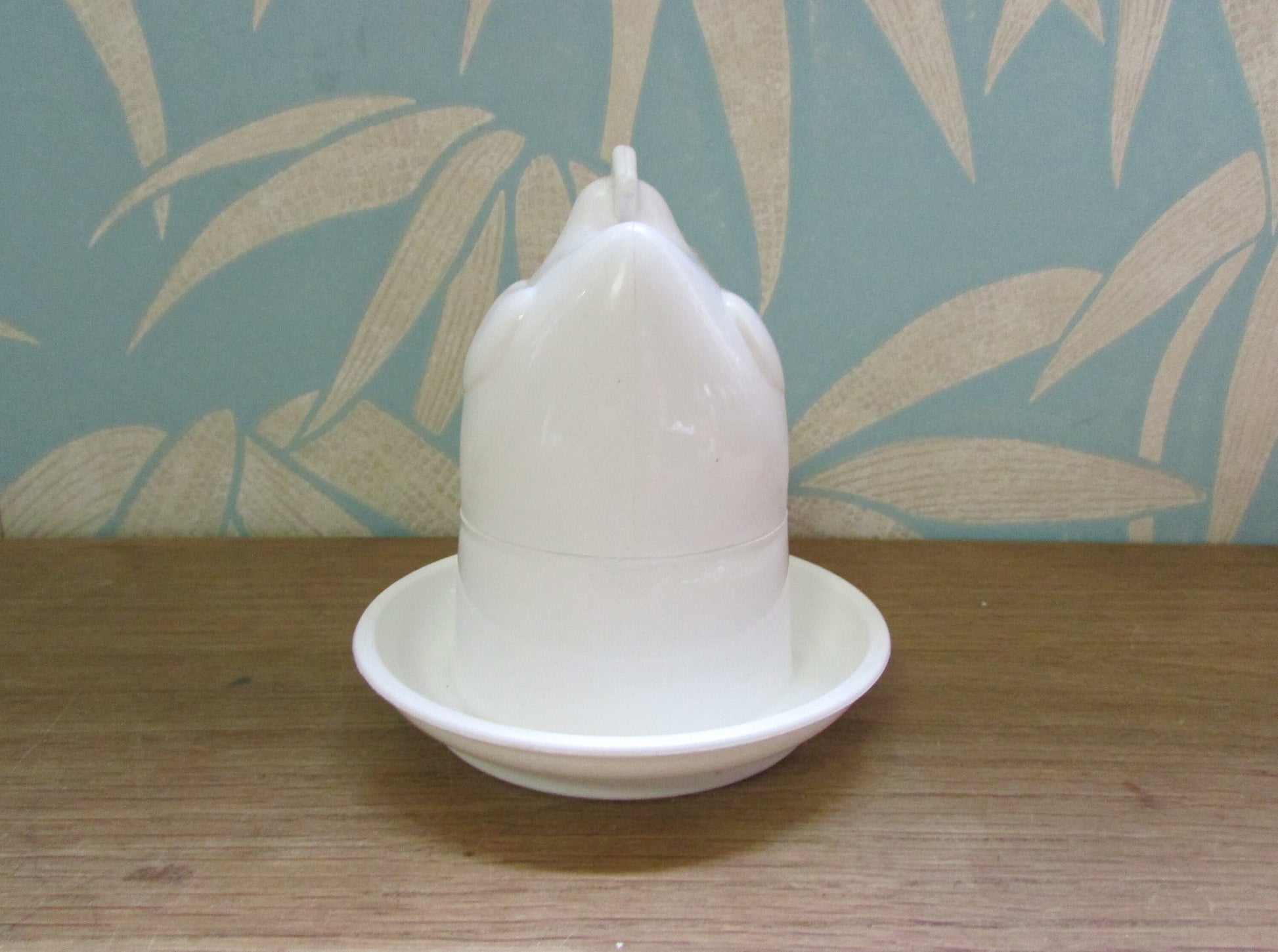 Retro white plastic microwaveable chicken-shaped egg poacher