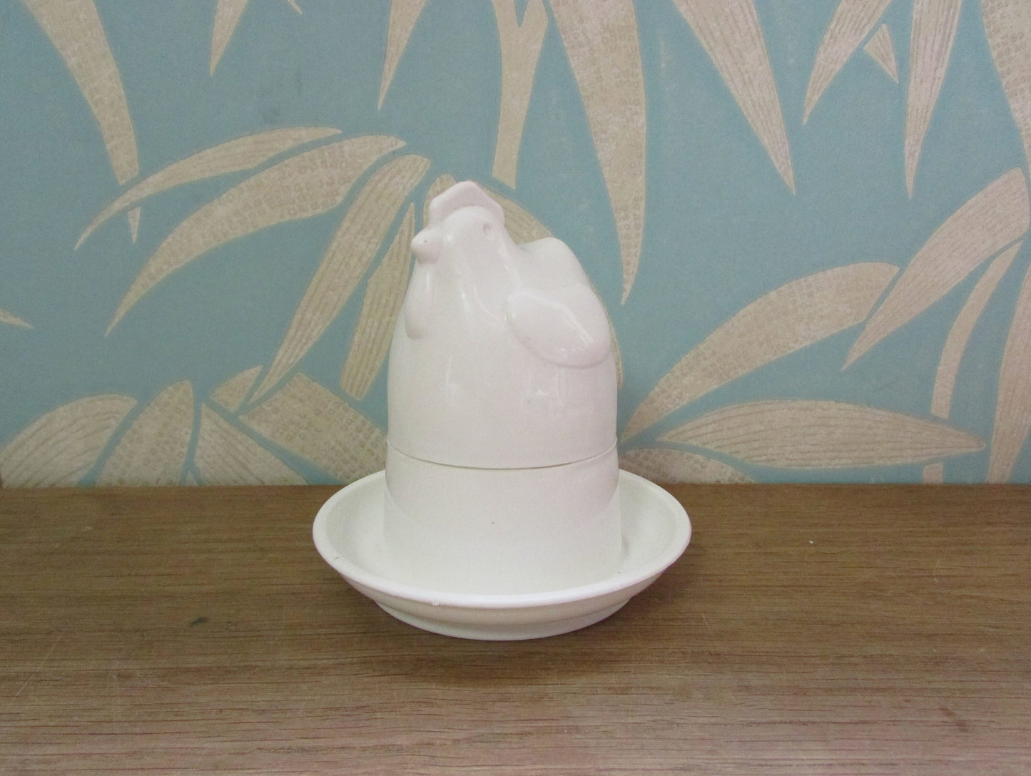 Retro white plastic microwaveable chicken-shaped egg poacher