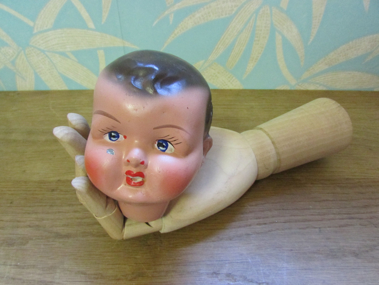 Three antique porcelain baby doll heads - with or without vintage bottle crate
