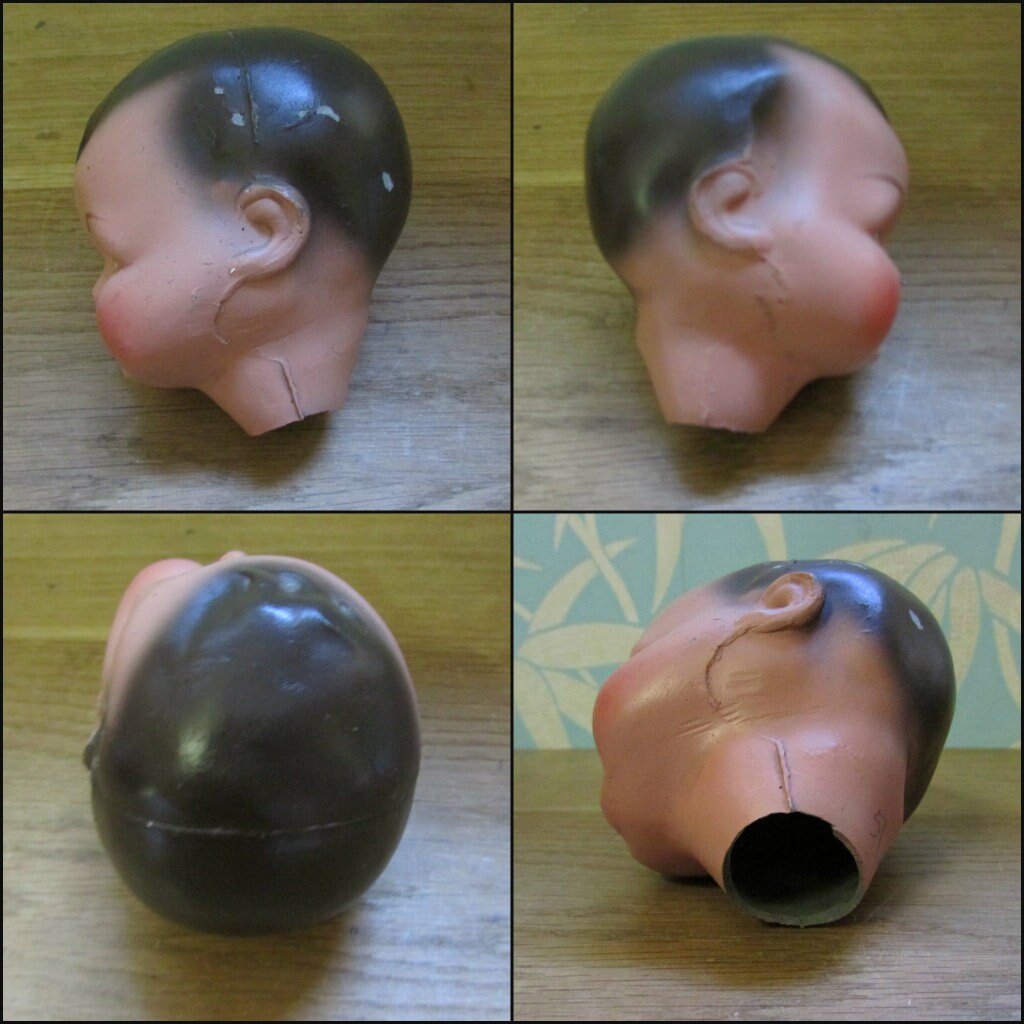 Three antique porcelain baby doll heads - with or without vintage bottle crate